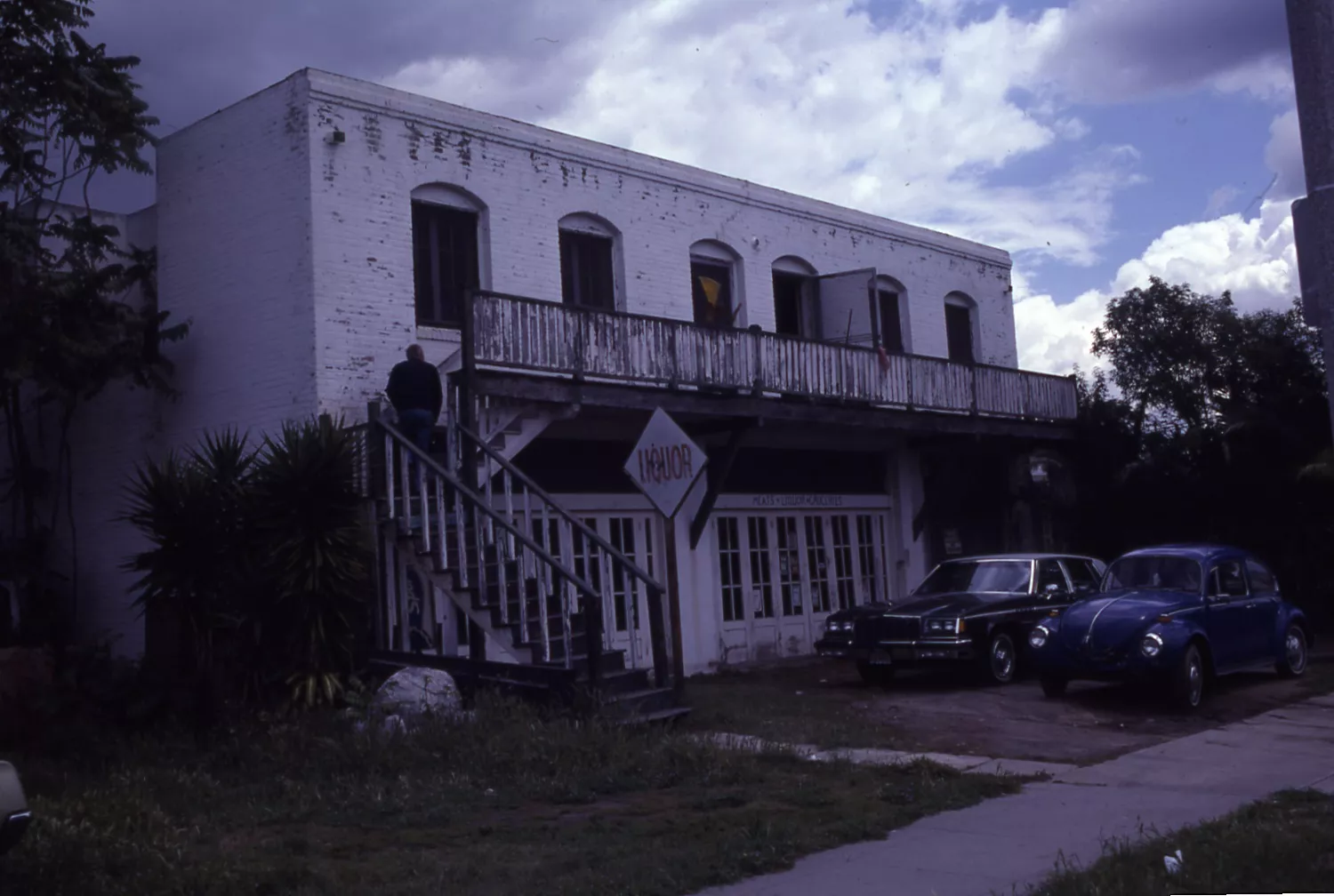 A colored photo of the exterior of Loumagne&#039;s Market before rehabilitation in 1983.