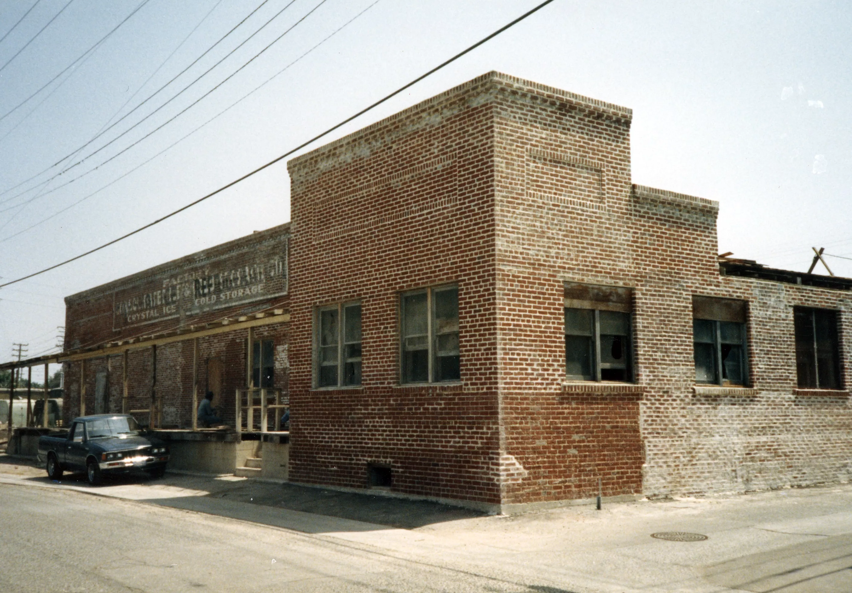 A colored photo of the Crystal Ice House&#039;s exterior during rehab in 1986.