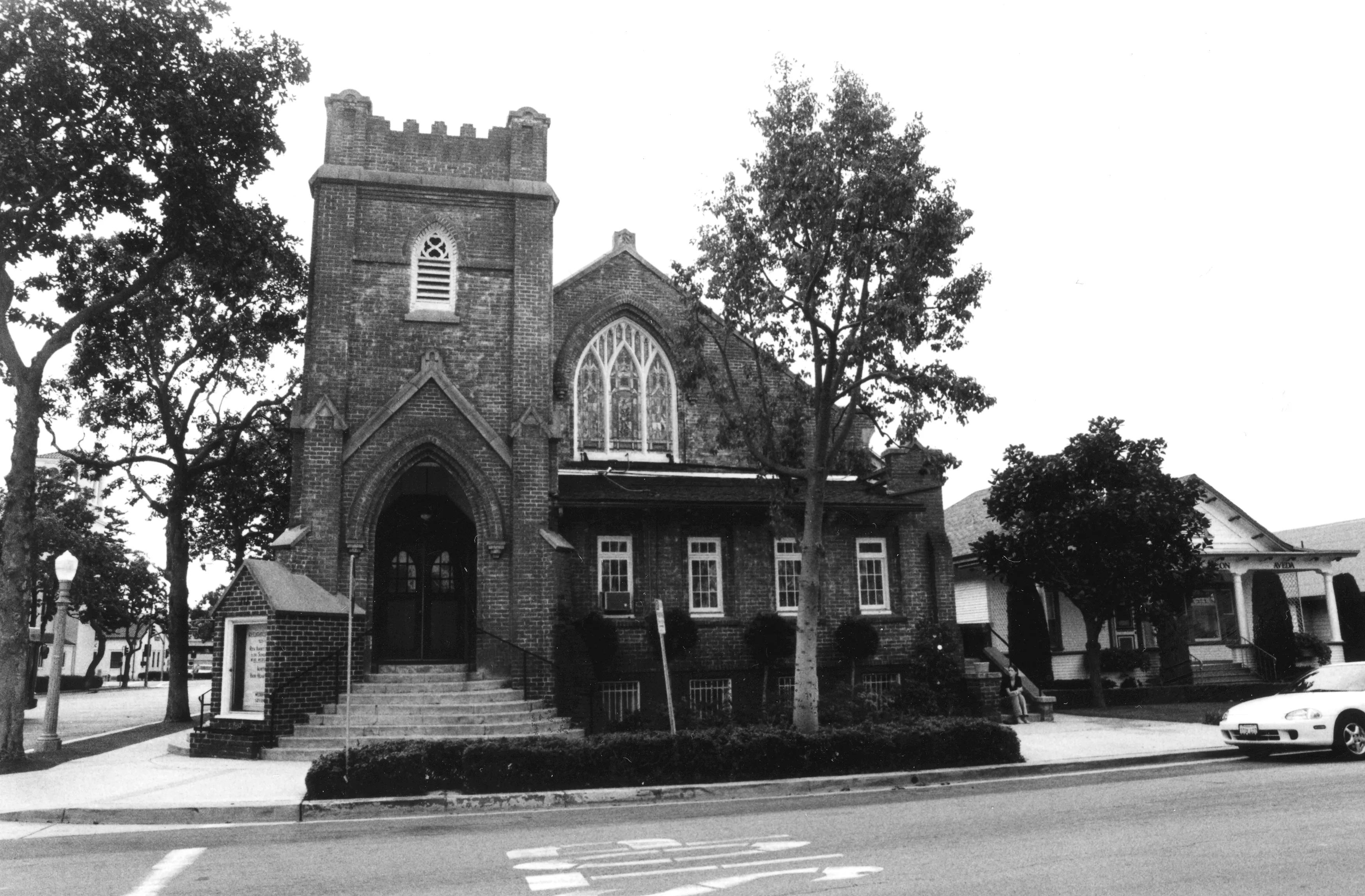 A black and white photograph of the Methodist Church and Parsonage in 2000.