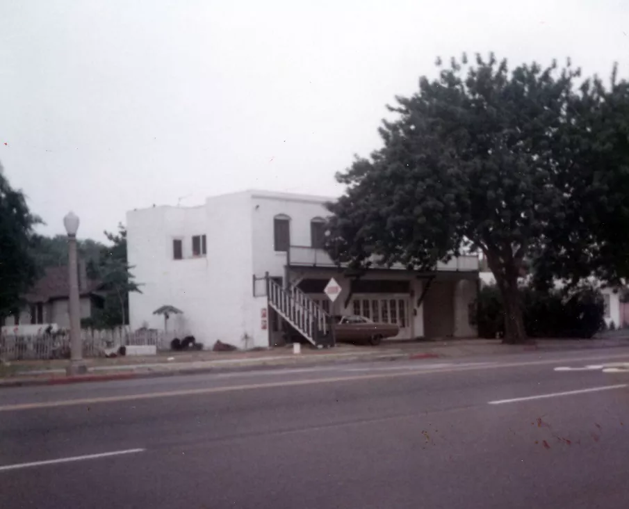 A colored photo of the street view of Loumagne&#039;s Market in 1973