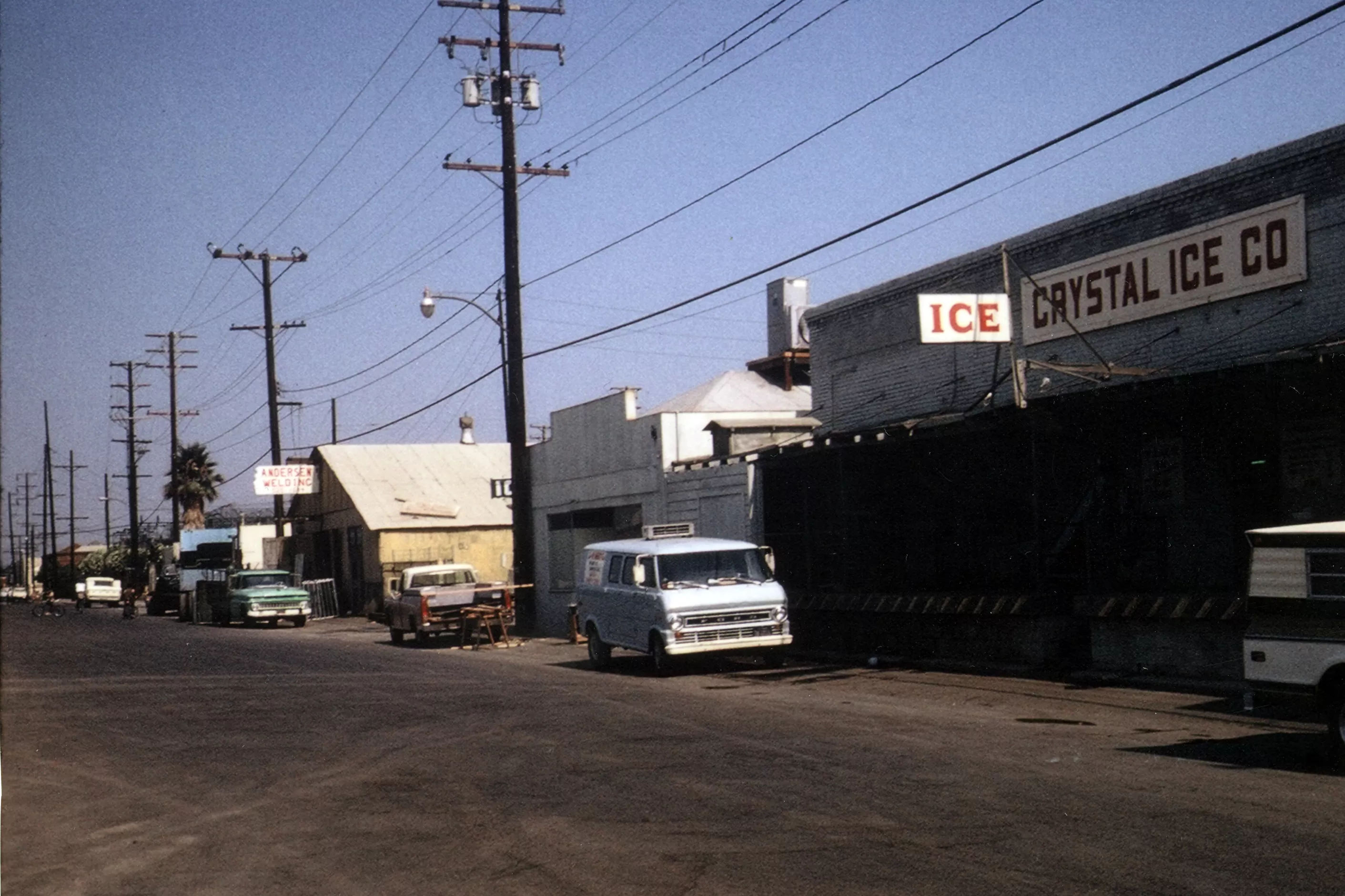 A colored photo of the Walnut street scene by the Crystal Ice House in 1973.