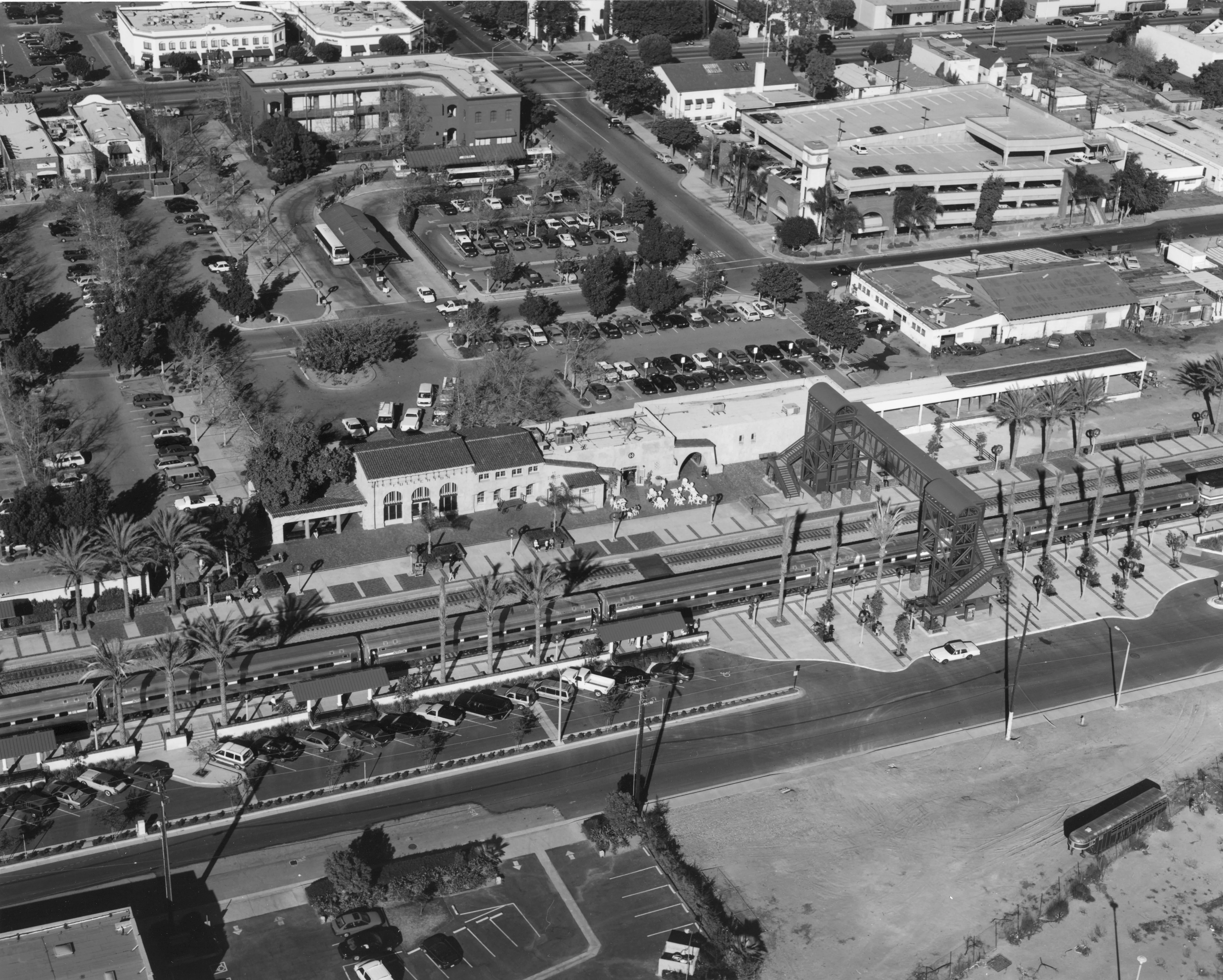 A black and white photograph of the aerial view of the Santa Fe Railway Passenger &amp; Freight Depot.