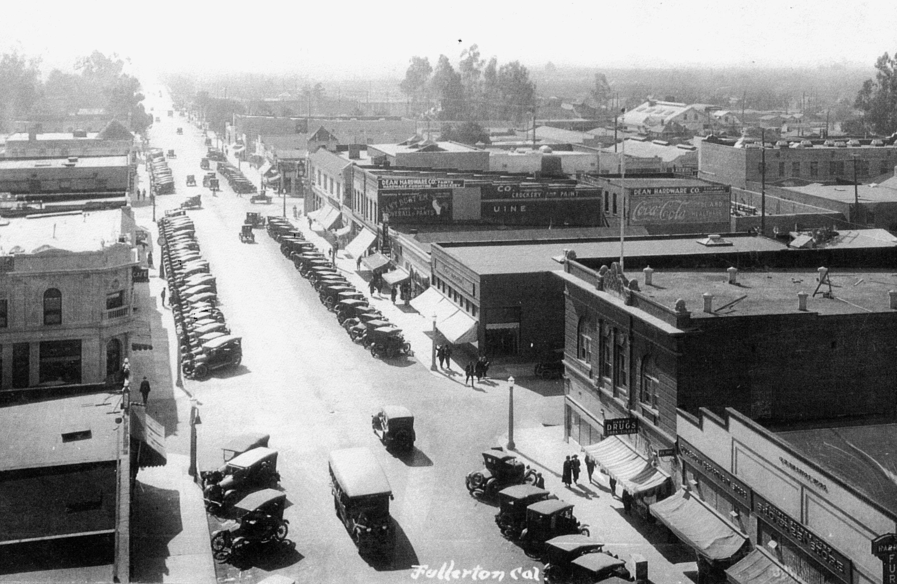 A black and white photograph of a birdseye view of the Dean Block in the 1920s. The bottom of the photo reads: Fullerton, California.