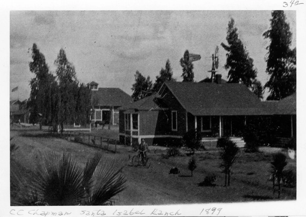 A black and white photograph of the Chapman Ranch in 1899. The caption written directly below the photo reads: CC Chapman Santa Isabel Ranch 1899.