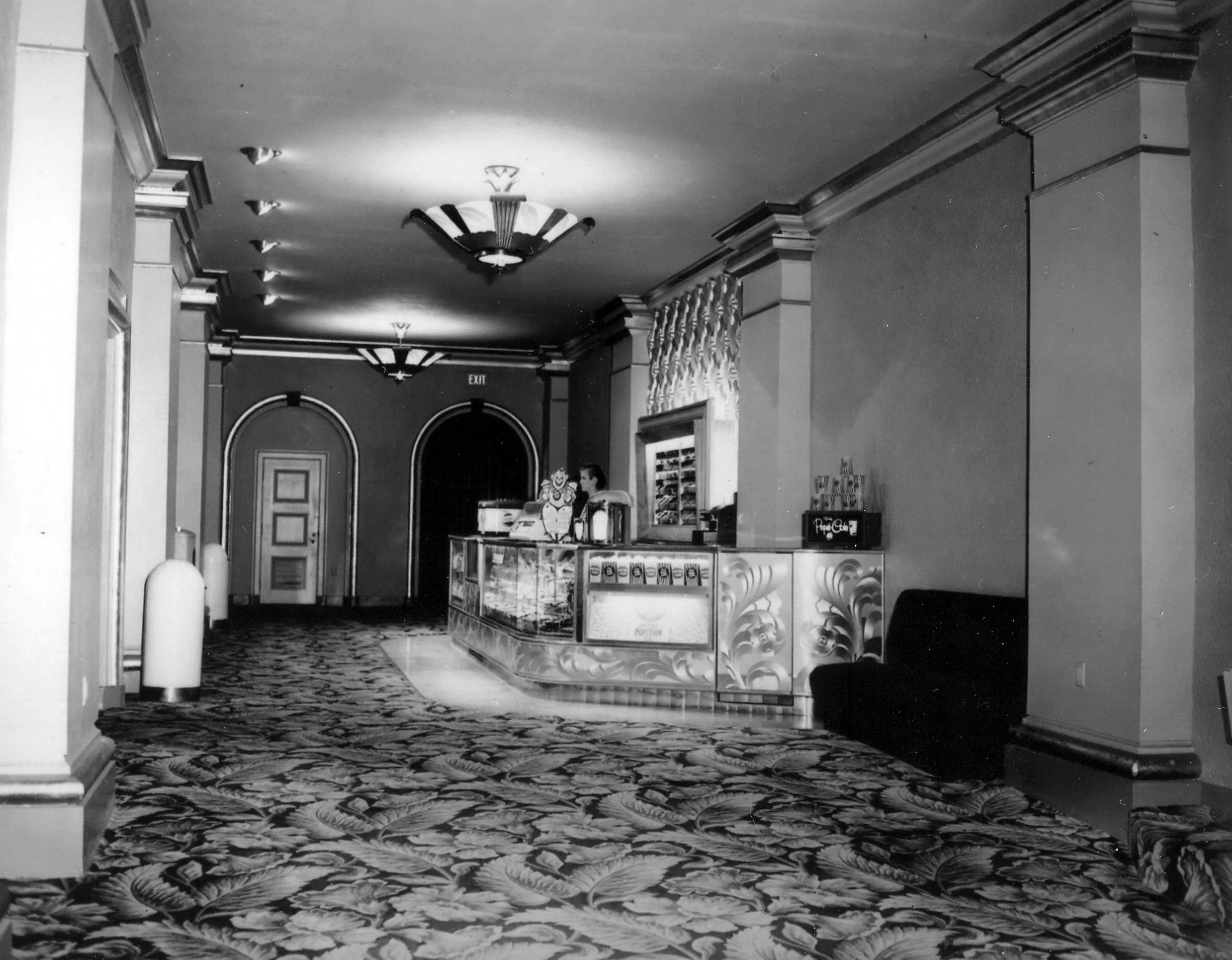 A black and white photograph of the concession stand inside the Alician Court Theatre.