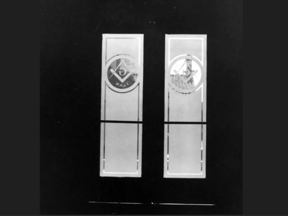 A black and white photograph of the second Masonic Temple&#039;s front doors in 1994 before renovation.