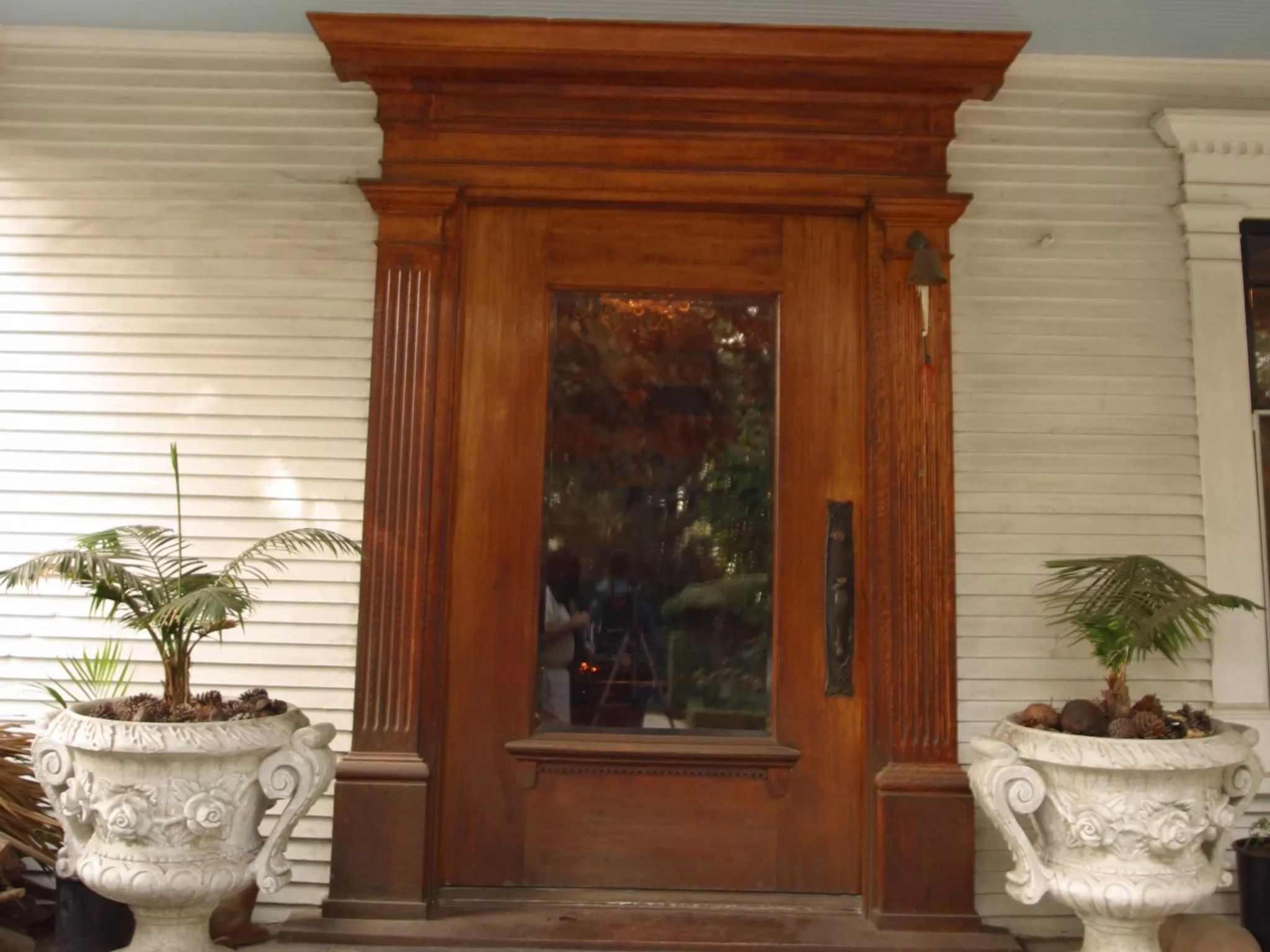 A colored photo of the front door entrance of the Pierotti House &amp; Gardens in 2006.