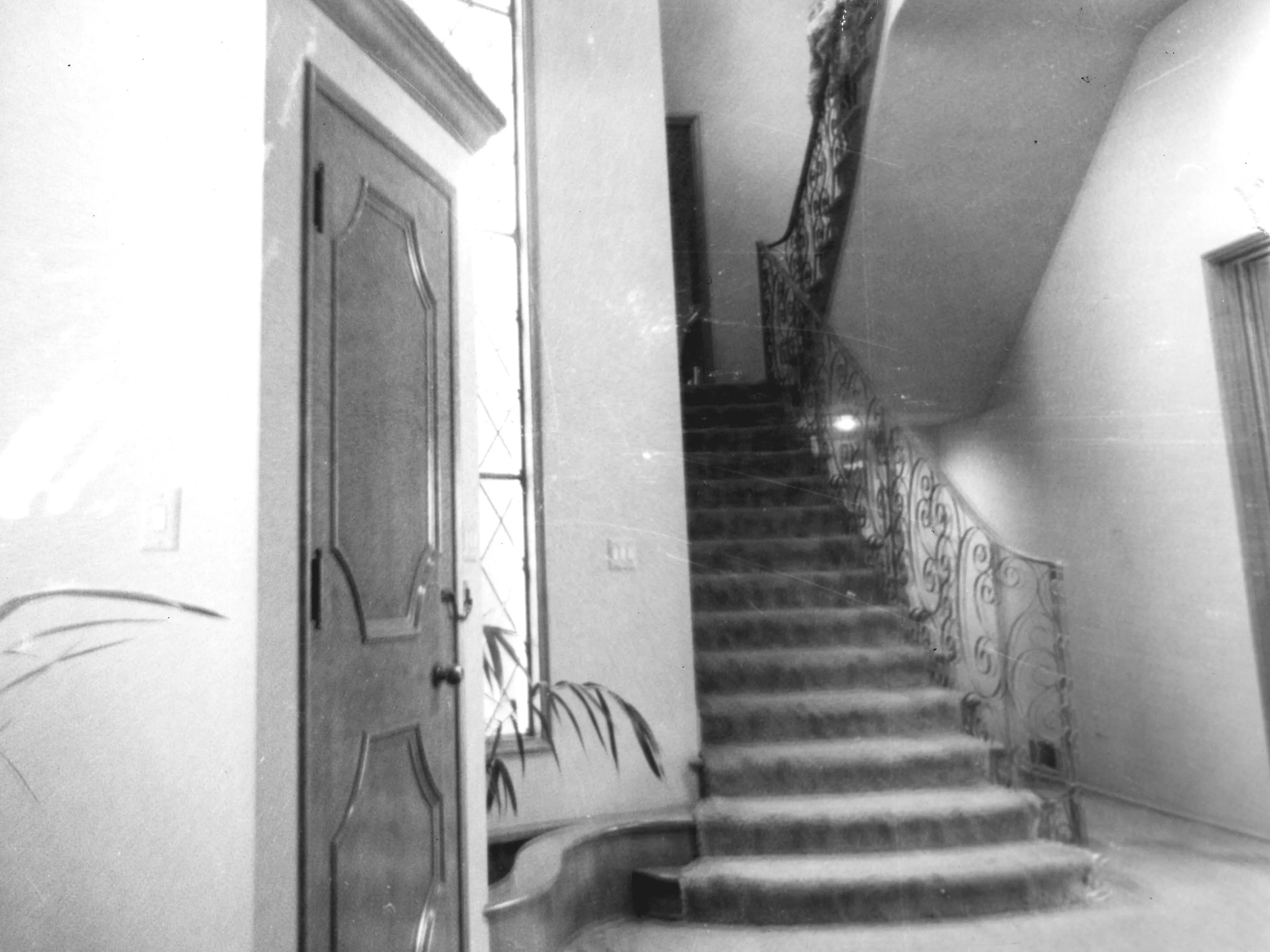 A black and white photograph of the interior staircase inside the El Dorado Ranch in 1984.