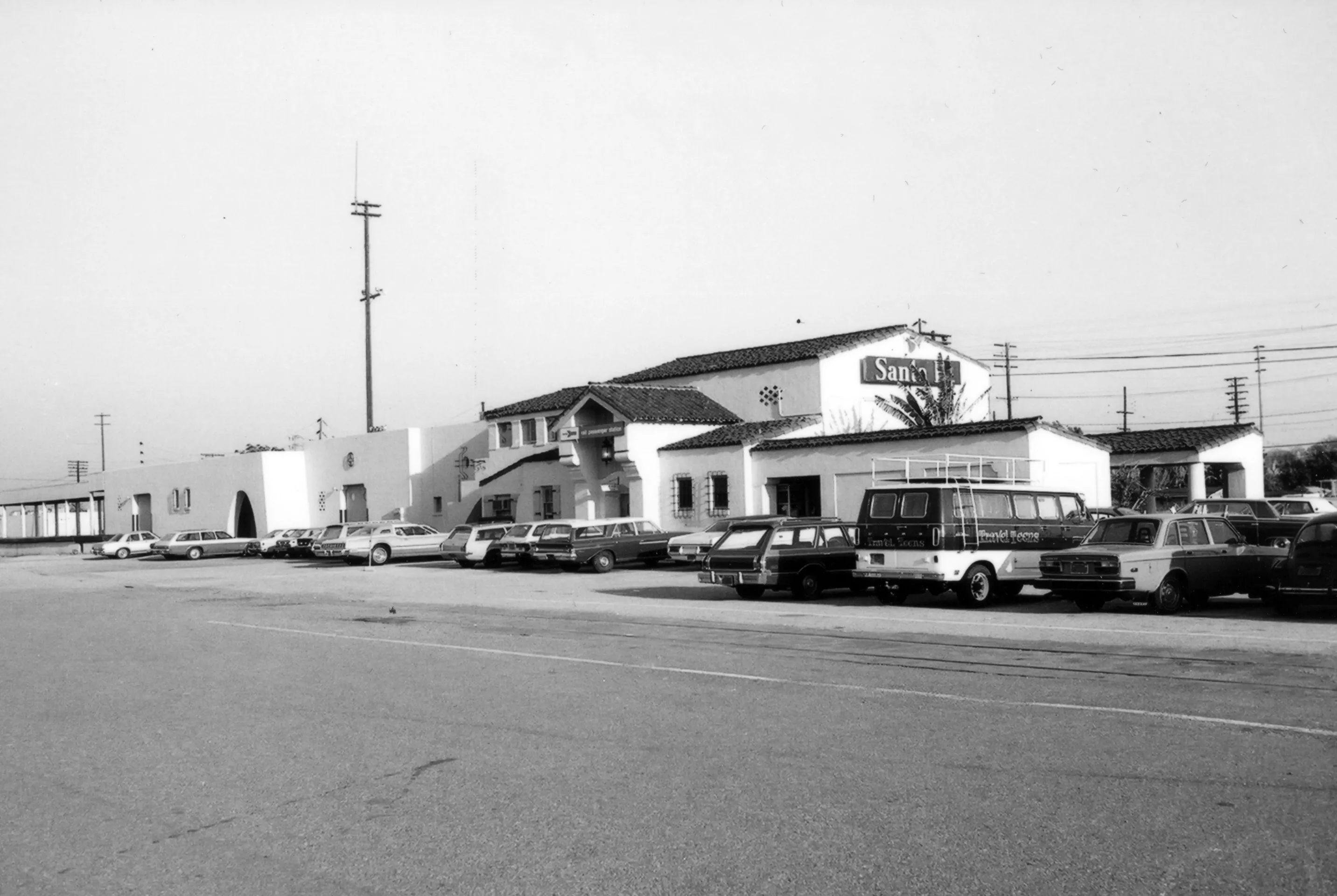 A black and white photograph of the north side of the Santa Fe Railway Passenger &amp; Freight Depot in 1978.