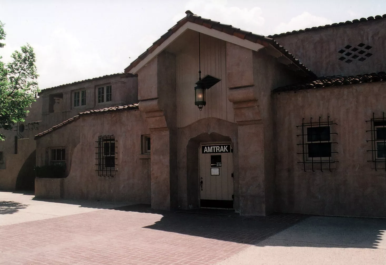 A colored photo of the north side of the Santa Fe Railway Passenger &amp; Freight Depot in 2021.