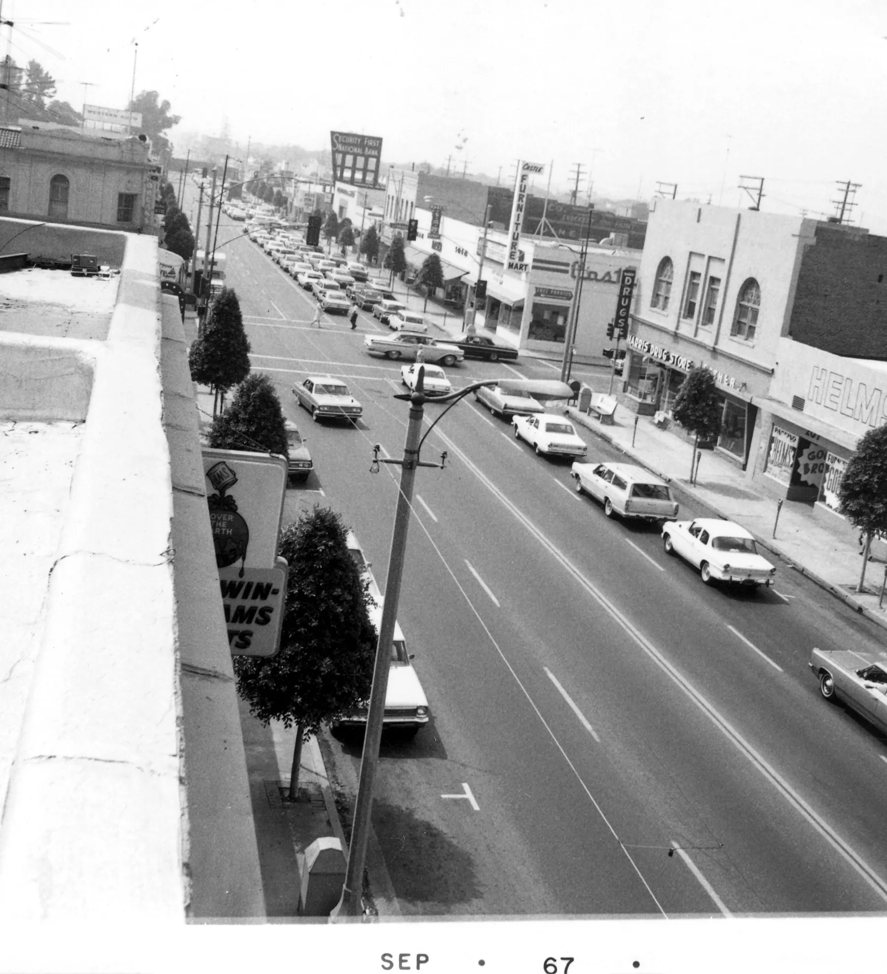 A black and white photograph of the street scene of the first Masonic Temple in 1967. The bottom of the photo reads: September &#039;67.