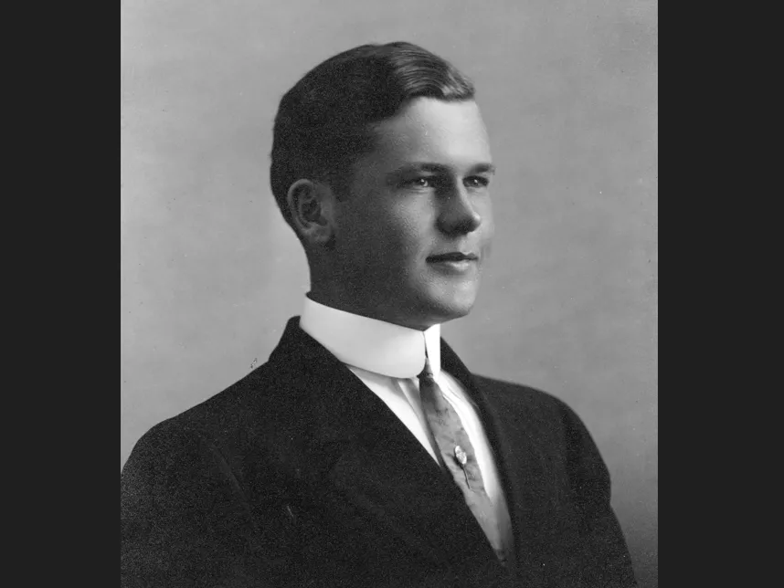 A black and white portrait photograph of Arthur Kelley.