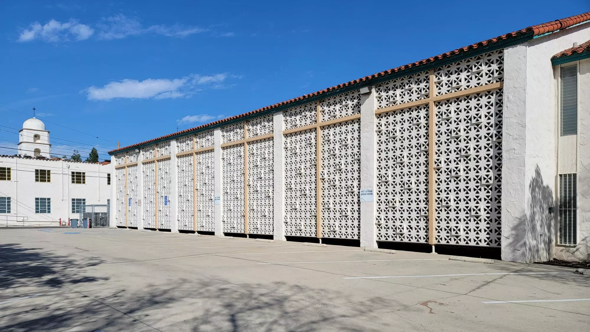 A colored photo of the brise soleil on the west side of the First Lutheran Church house in 2025.