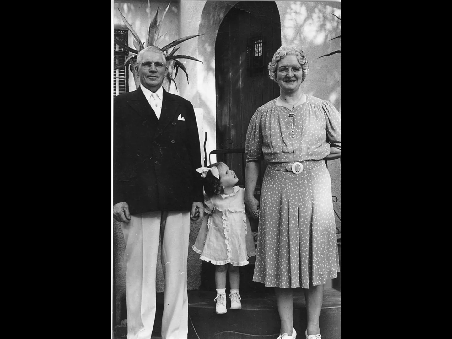 A black and white photograph of three members of the Bruns Family.