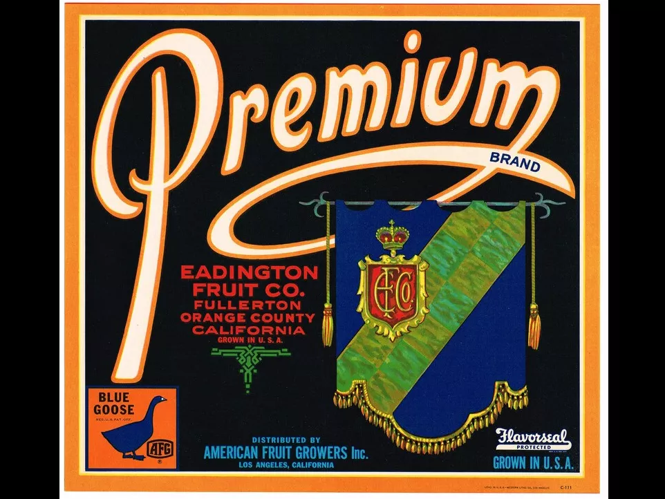 A colored photo of the Eadington Citrus Label. The photo reads: Premium Brand. Eadington Fruit Co. Fullerton, Orange County, California. Grown in U.S.A. Distributed by American Fruit Growers Inc. Los Angeles, California. Flavorseal Protected. Grown in U.S.A.
