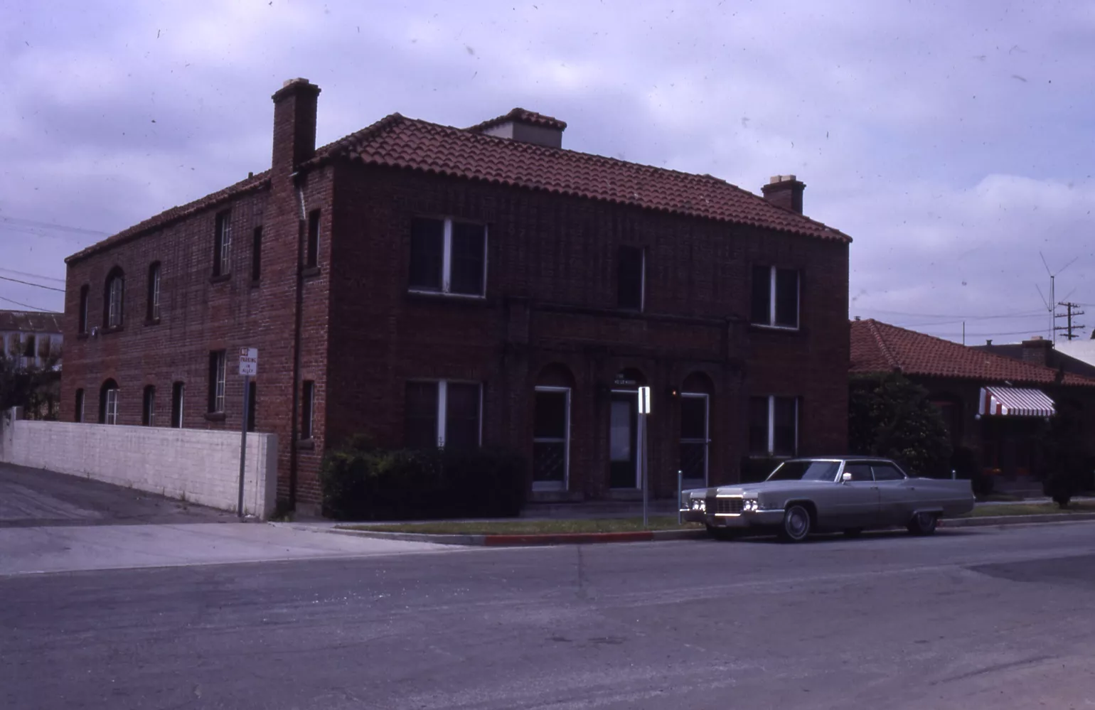 A colored photo of the exterior of the Samuel Dunphy Apartments (now Westwood Apartments) in 1982.