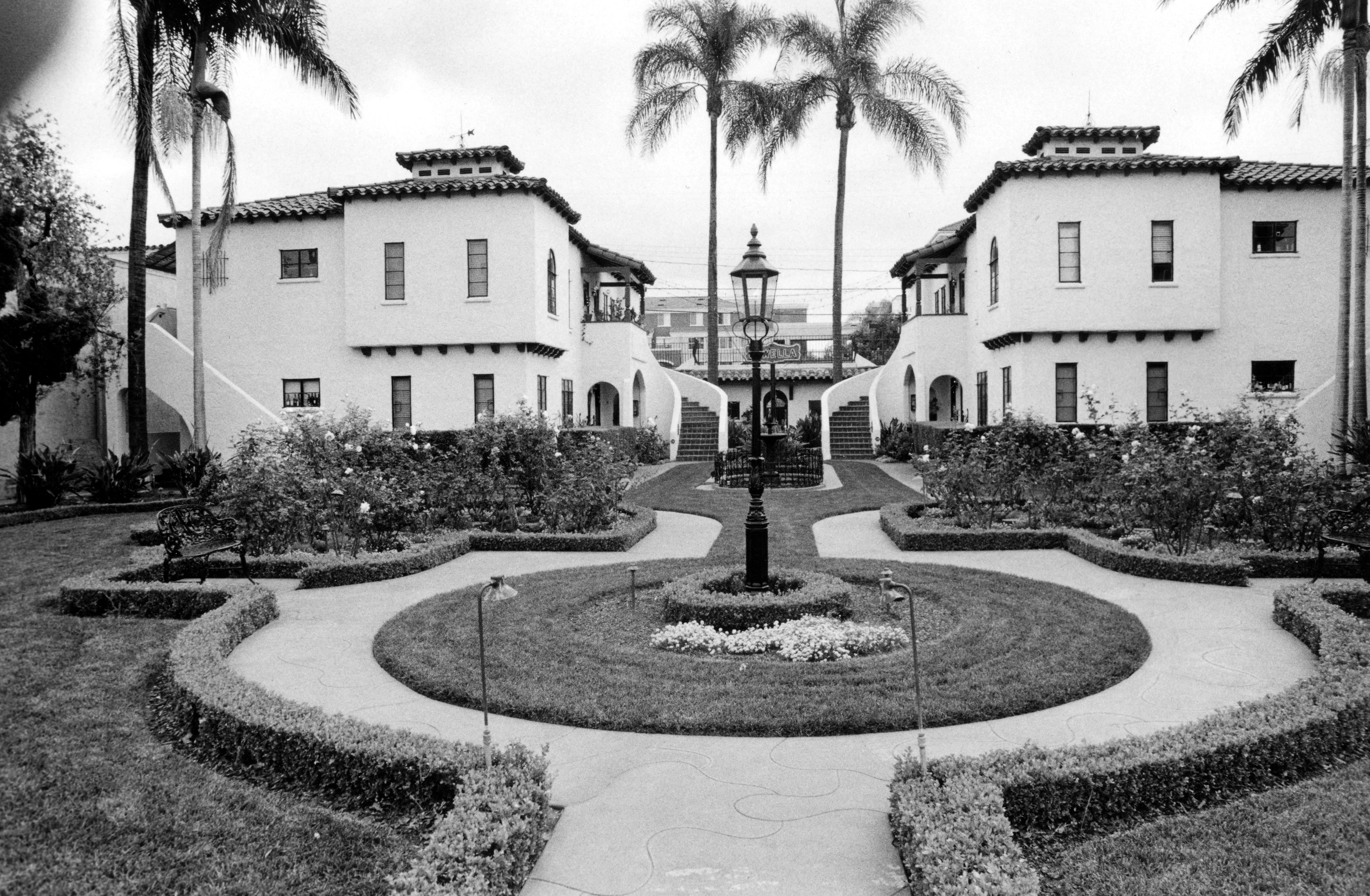 A black and white photograph of the exterior of the Dewella Apartments in 2008.