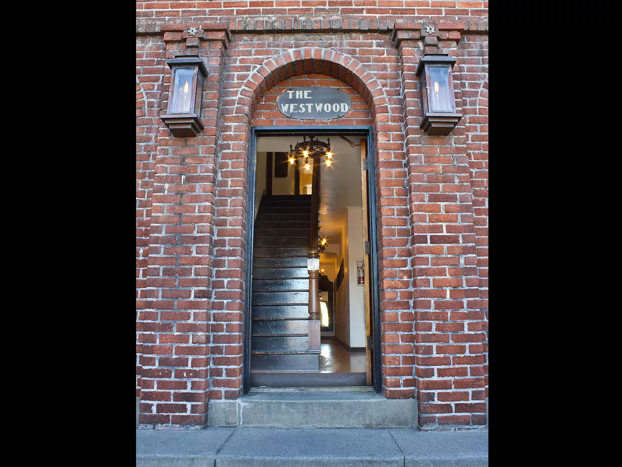 A colored photo of the front entrance to the Samuel Dunphy Apartments (now Westwood Apartments) in 2012.