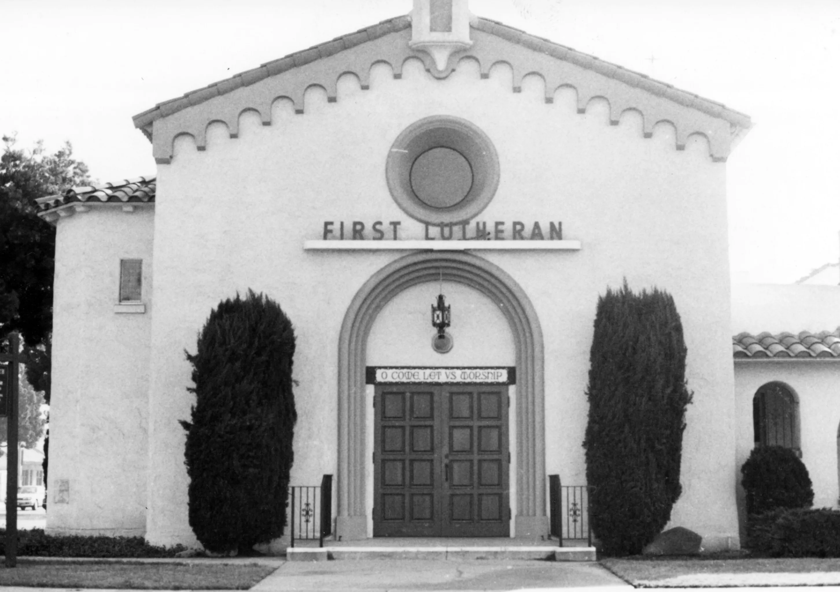 A black and white photograph of the front entrance of the First Lutheran Church circa 1960s.