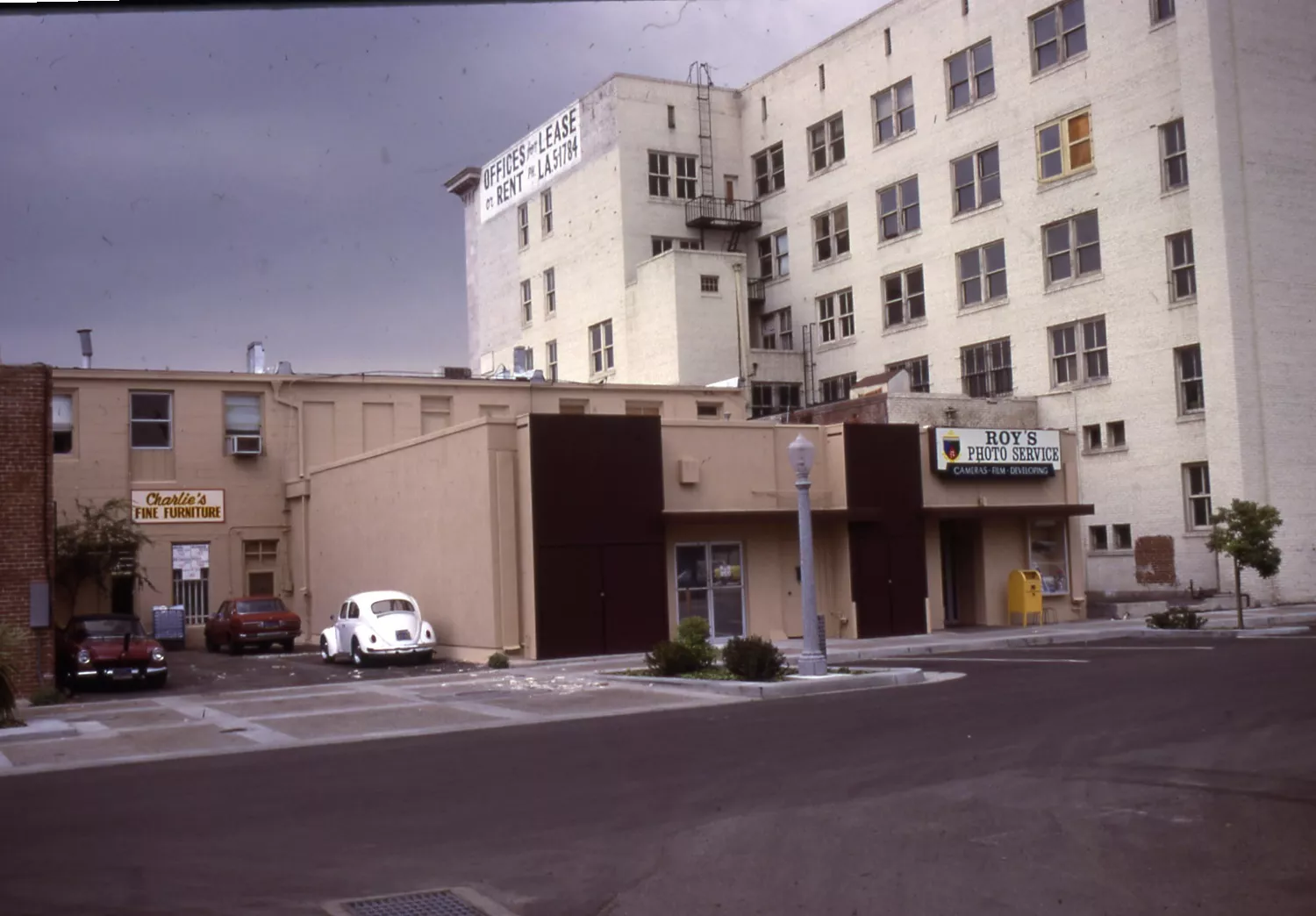 A colored photo of the rear of the Peter Schumacher Building in 1981.