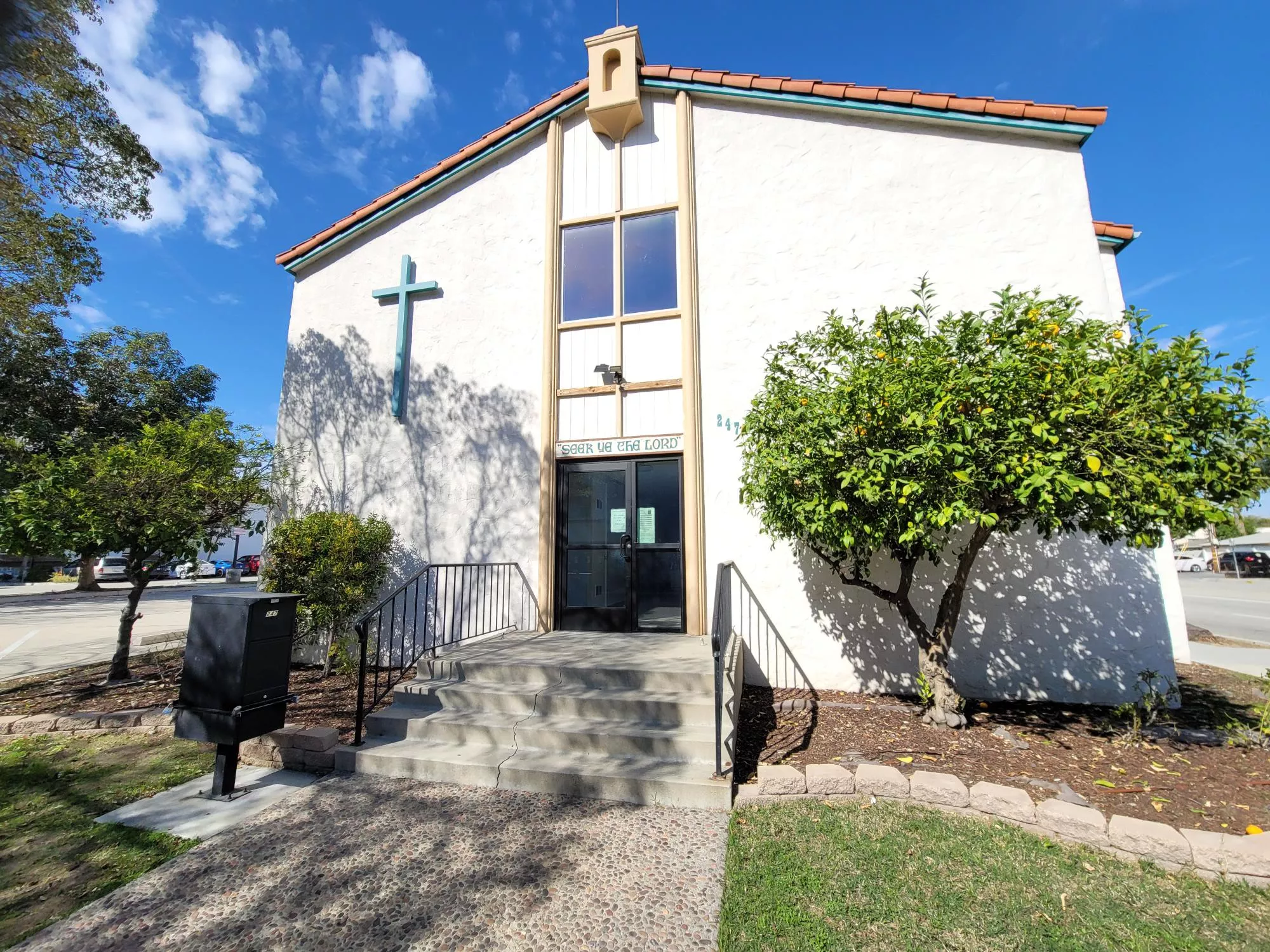 A colored photo of the south side of the First Lutheran Church house in 2025.