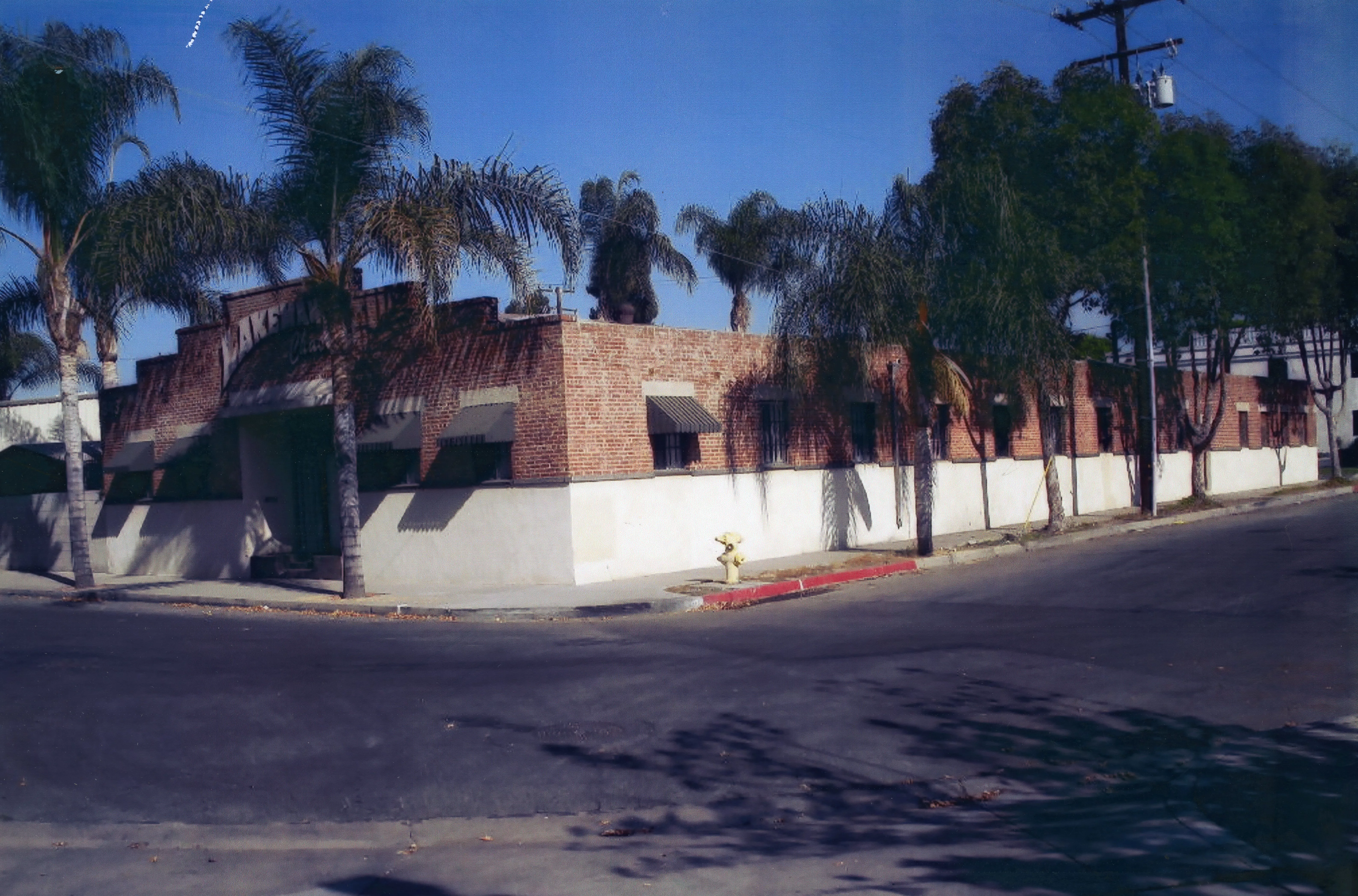 A colored photo of the exterior of the Miller Manufacturing Building (now Lakeman Chassis) in 2008.