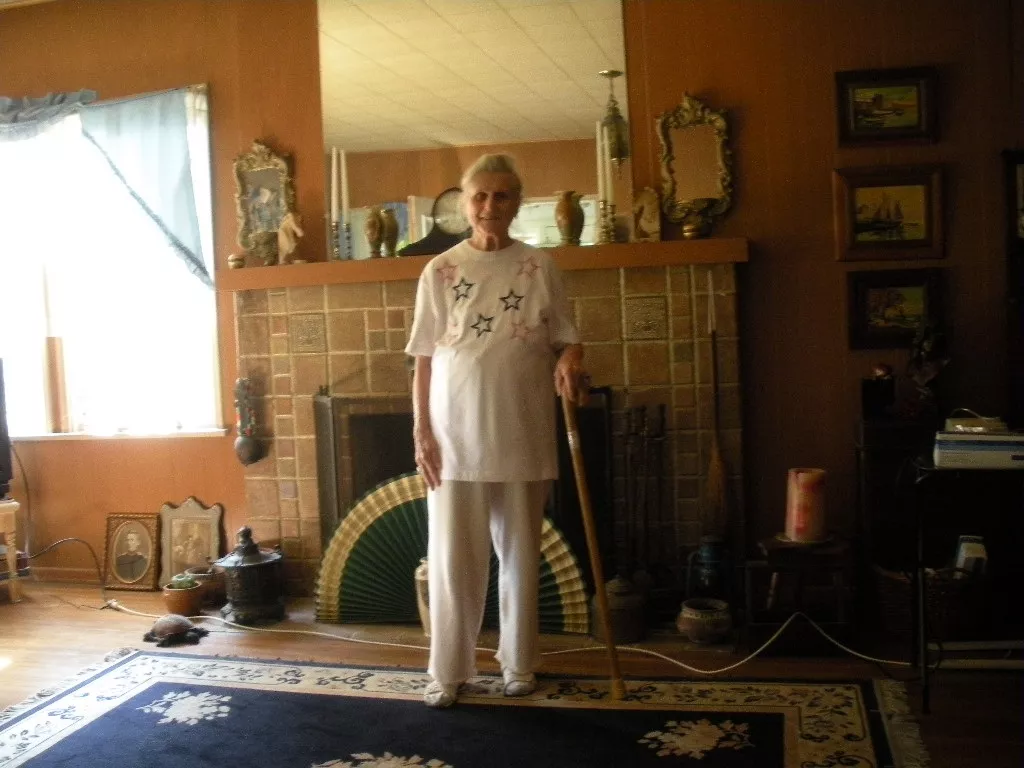 A colored photo of Harriet Spree in the living room of the Carrie Earl McFadden Ford House in 2010.