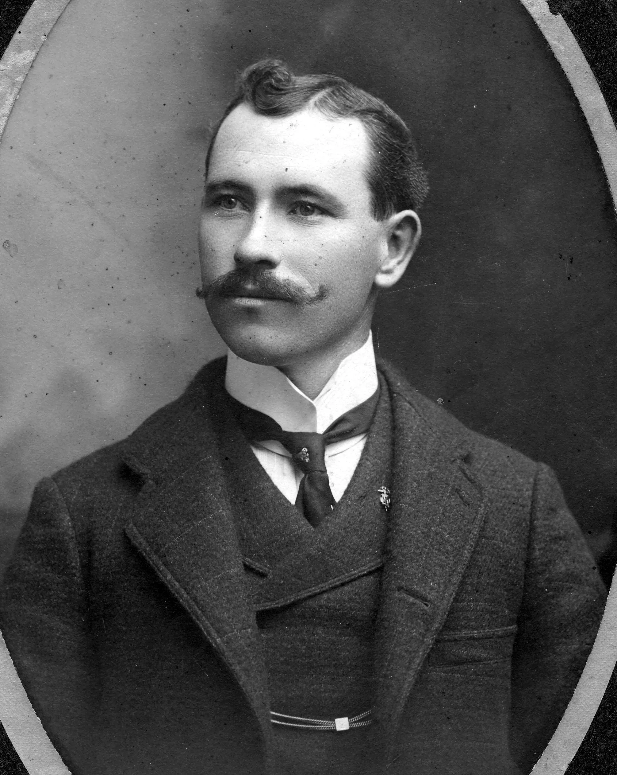 A black and white portrait photograph of John Gardiner.
