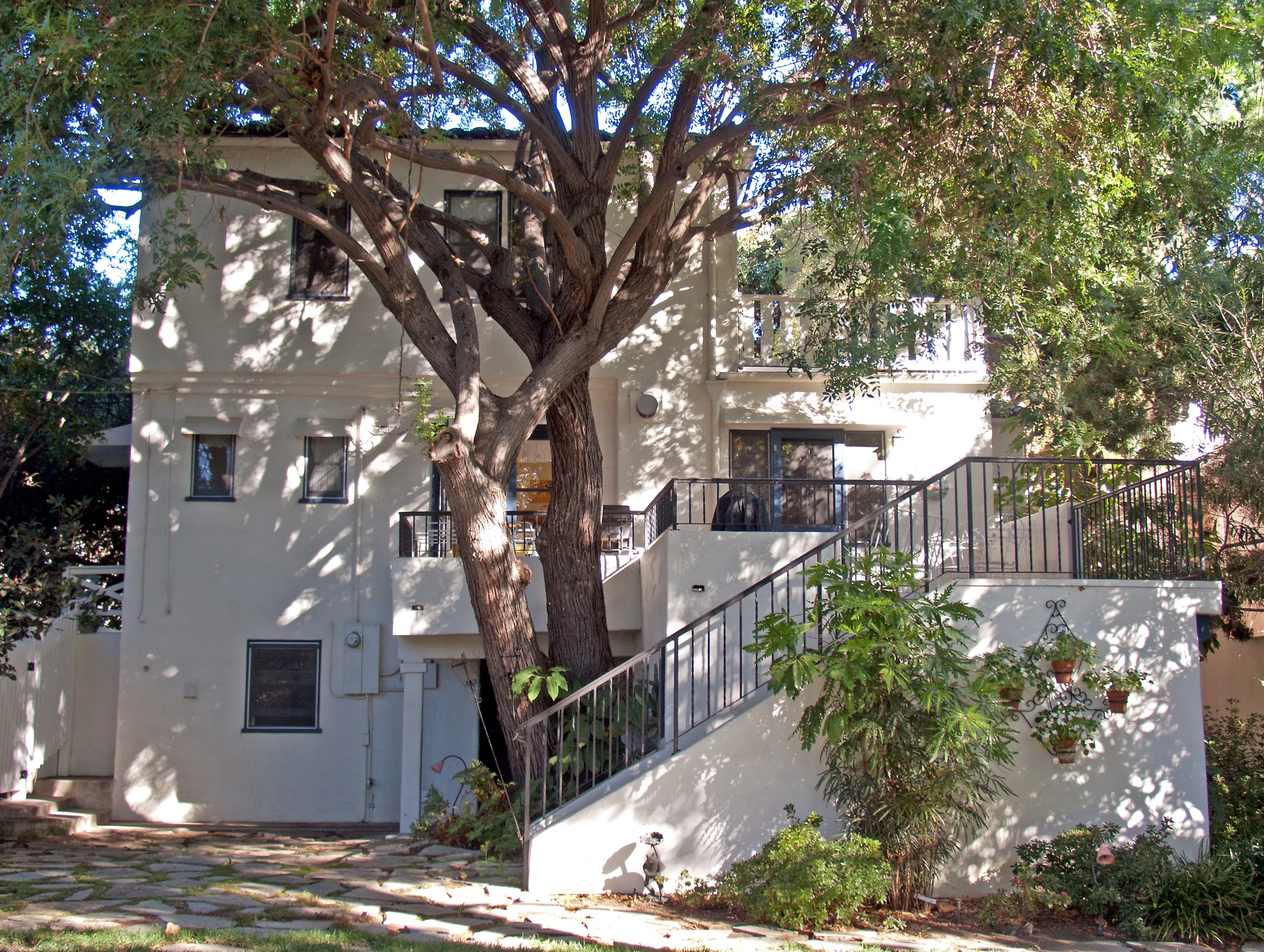 A colored photo of the rear of the Jesse Swearingen House from the backyard in 2012.