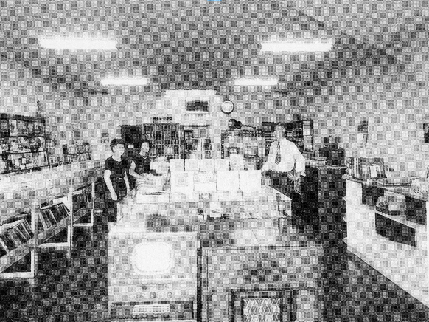 A black and white photograph of the shop interior for the Leo Fender Radio Shop in 1949.