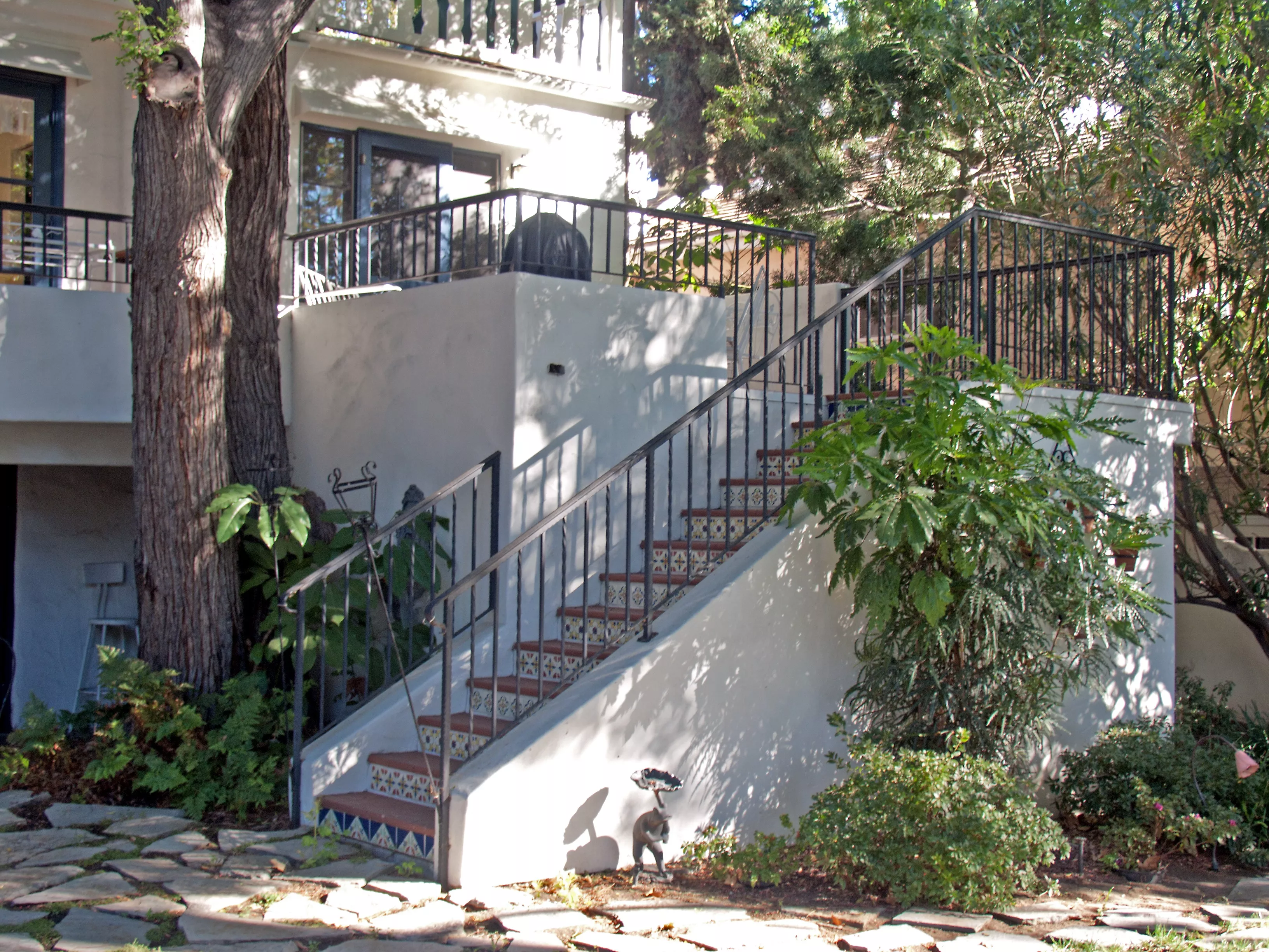 A colored photo of the stairs leading to the backyard of the Jesse Swearingen House in 2012.