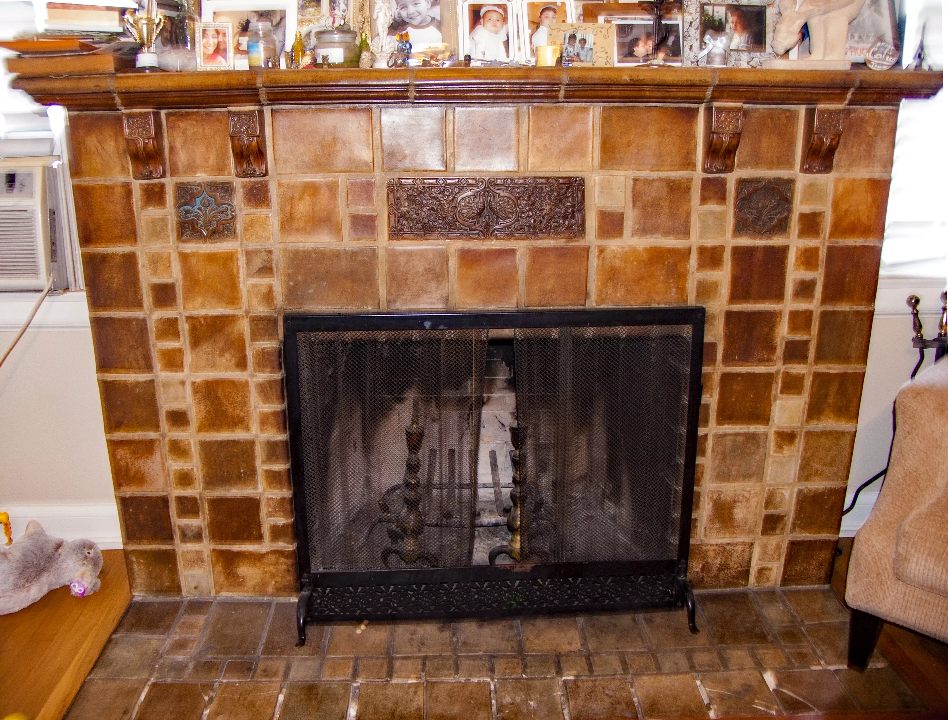 A colored photo of the Batchelder fireplace inside the Pomona Apartments in 2017.