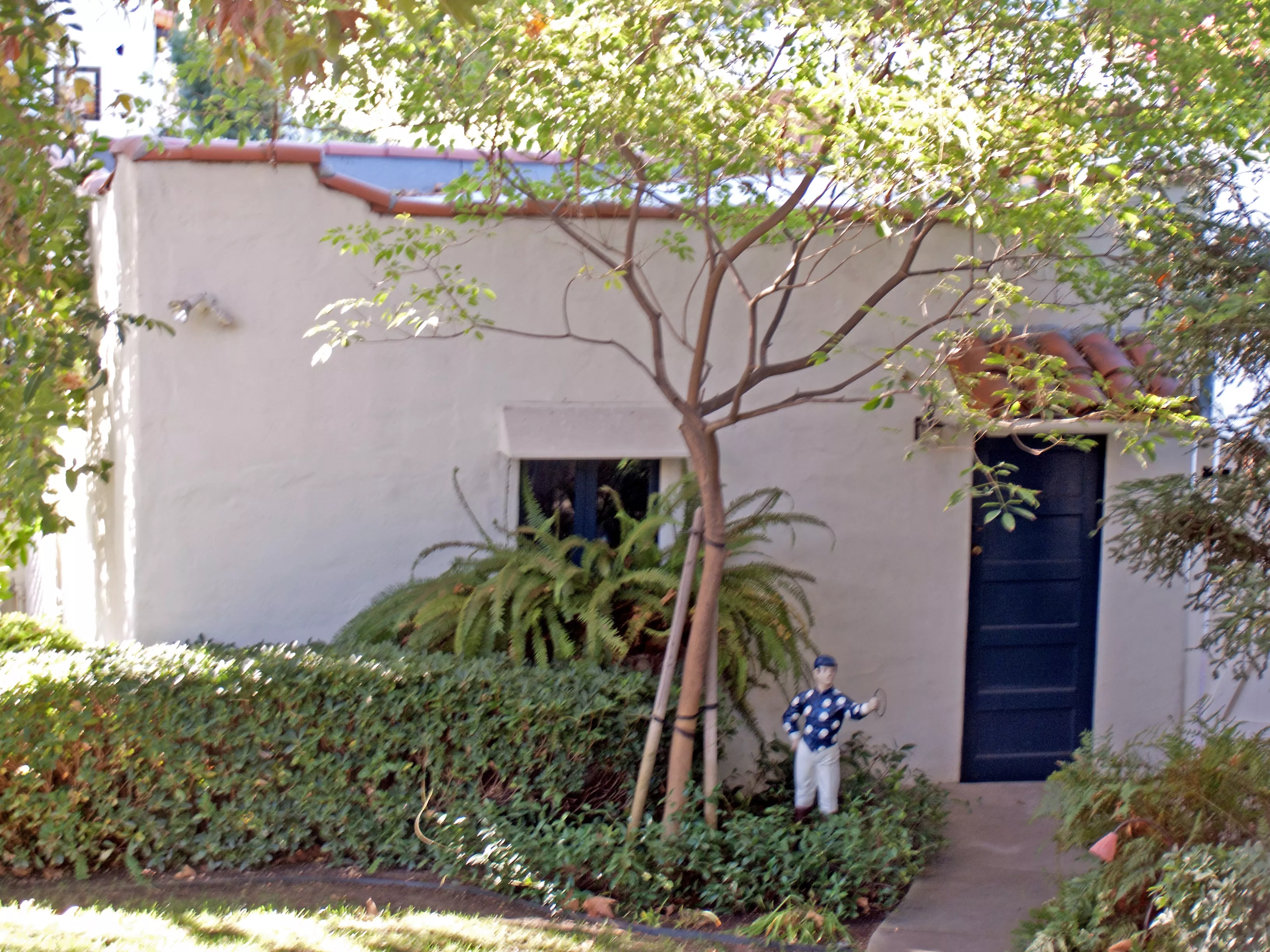 A colored photo of the detached garage of the Jesse Swearingen House in 2012.