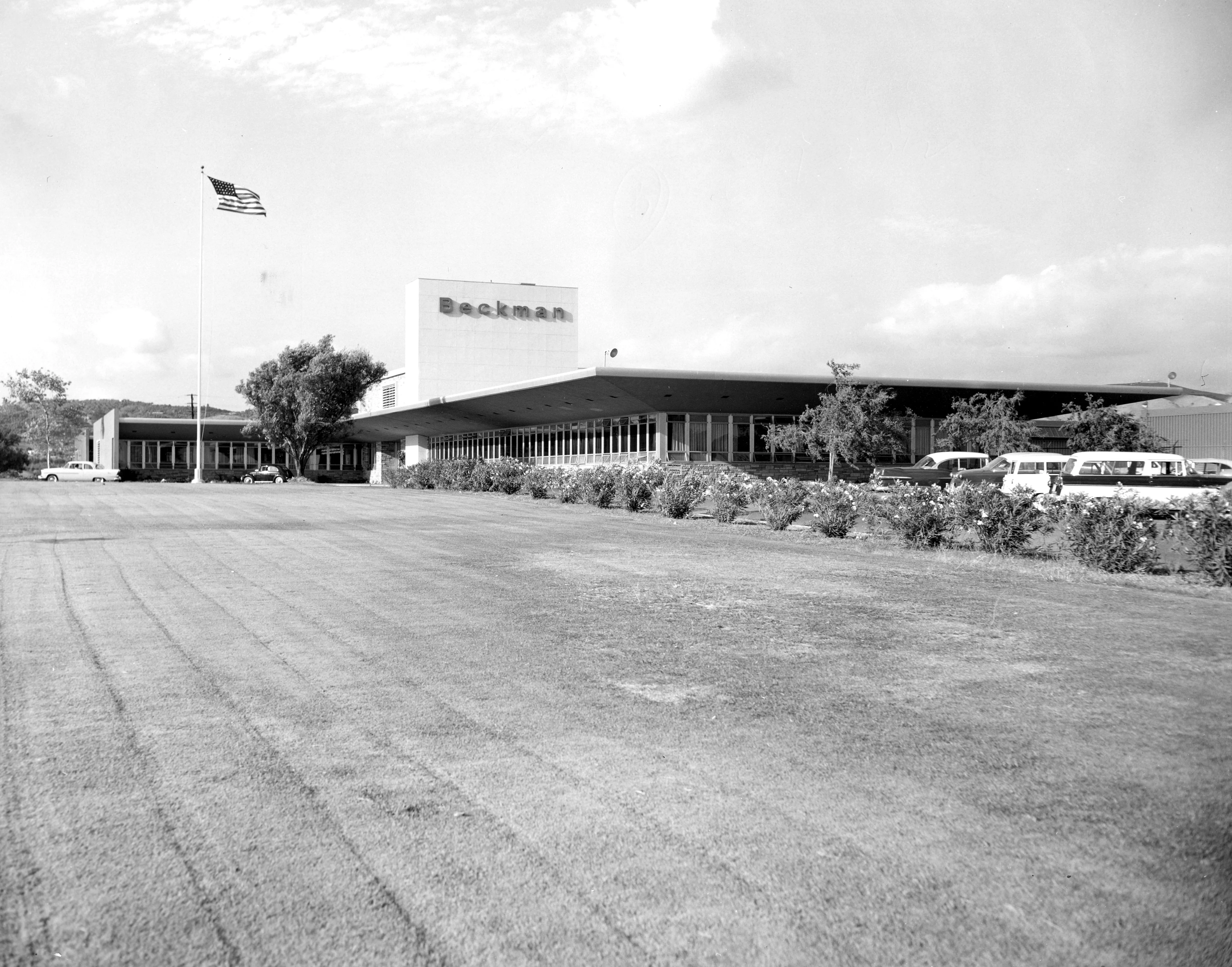 A black and white photograph of the exterior of the Beckman Instruments Administration Building in the 1950s.