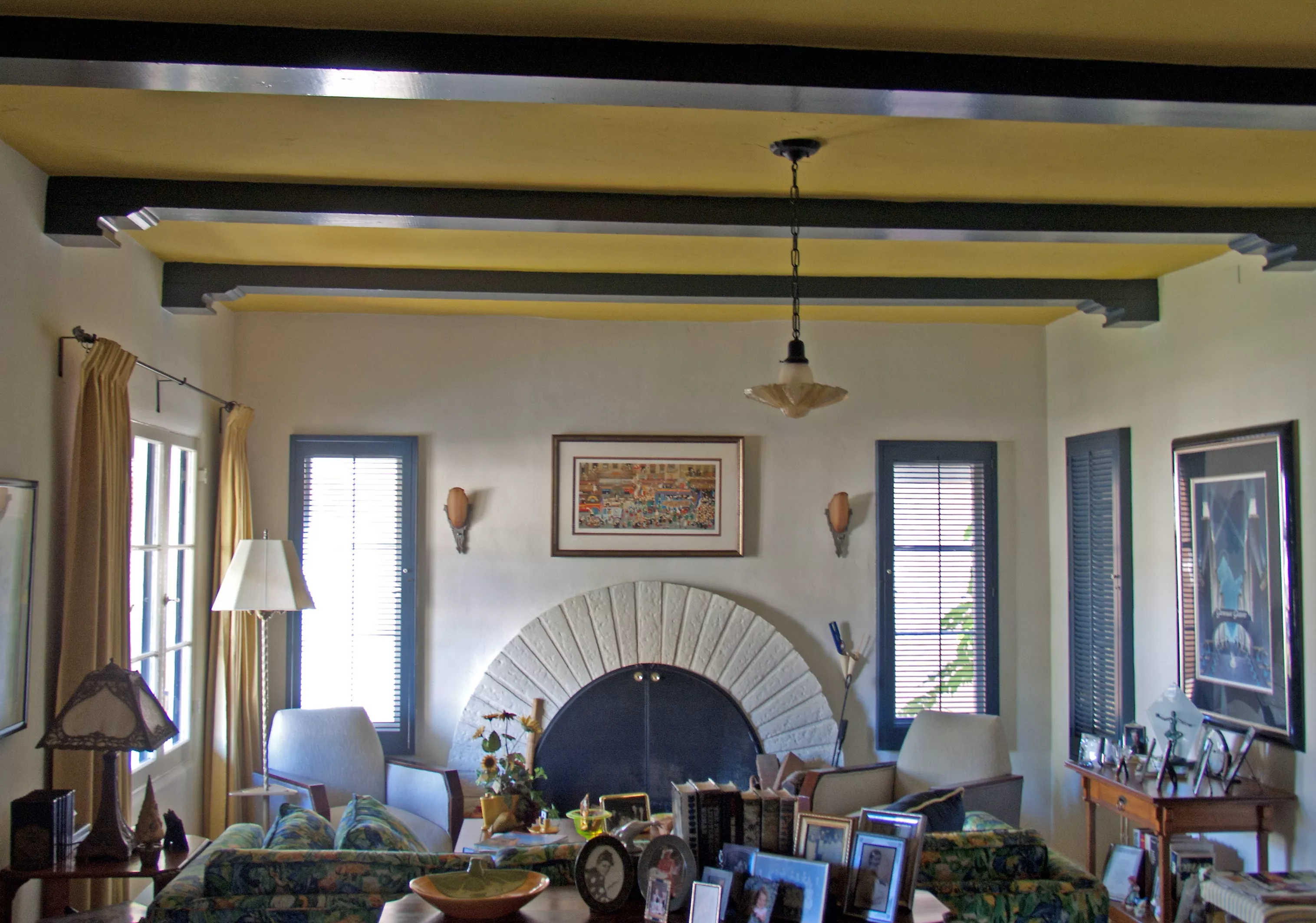 A colored photo of the living room and fireplace of the Jesse Swearingen House in 2012.