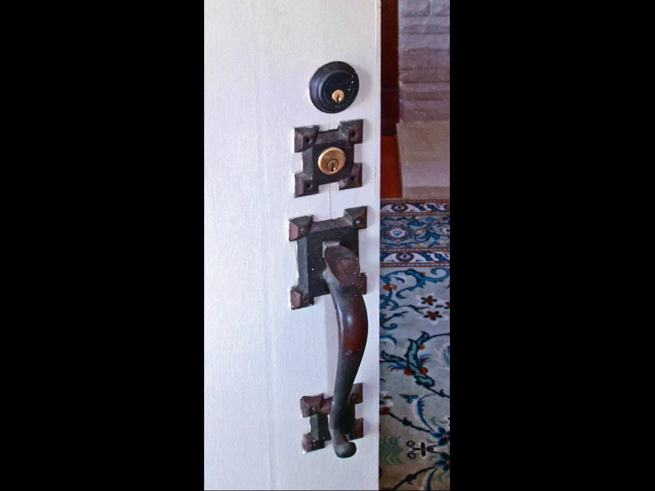 A colored photo of the original door hardware for the Clarence Spencer House in 2013.