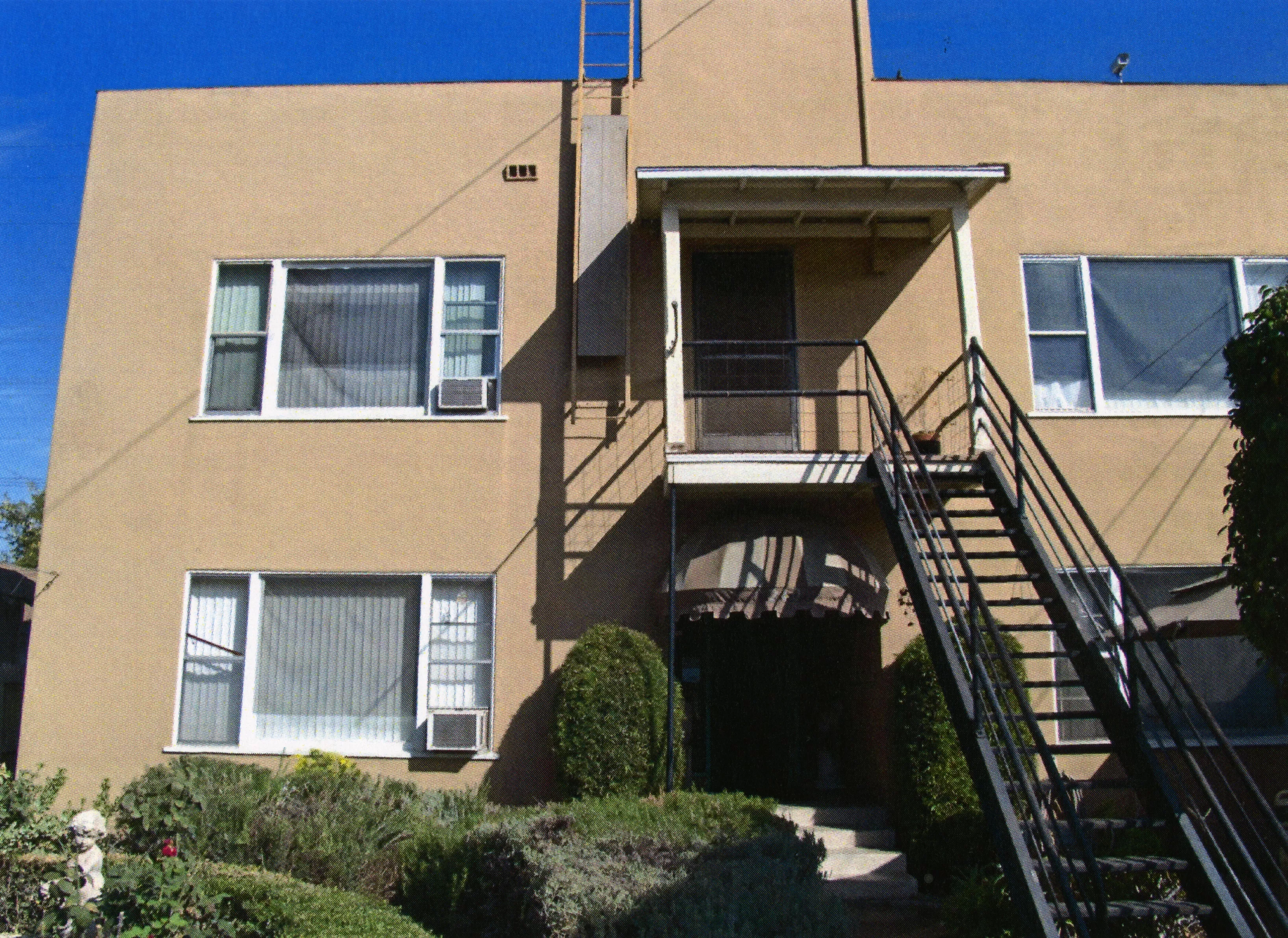 A colored photo of the rear exterior of the Fred Carter Apartment House in 2014.
