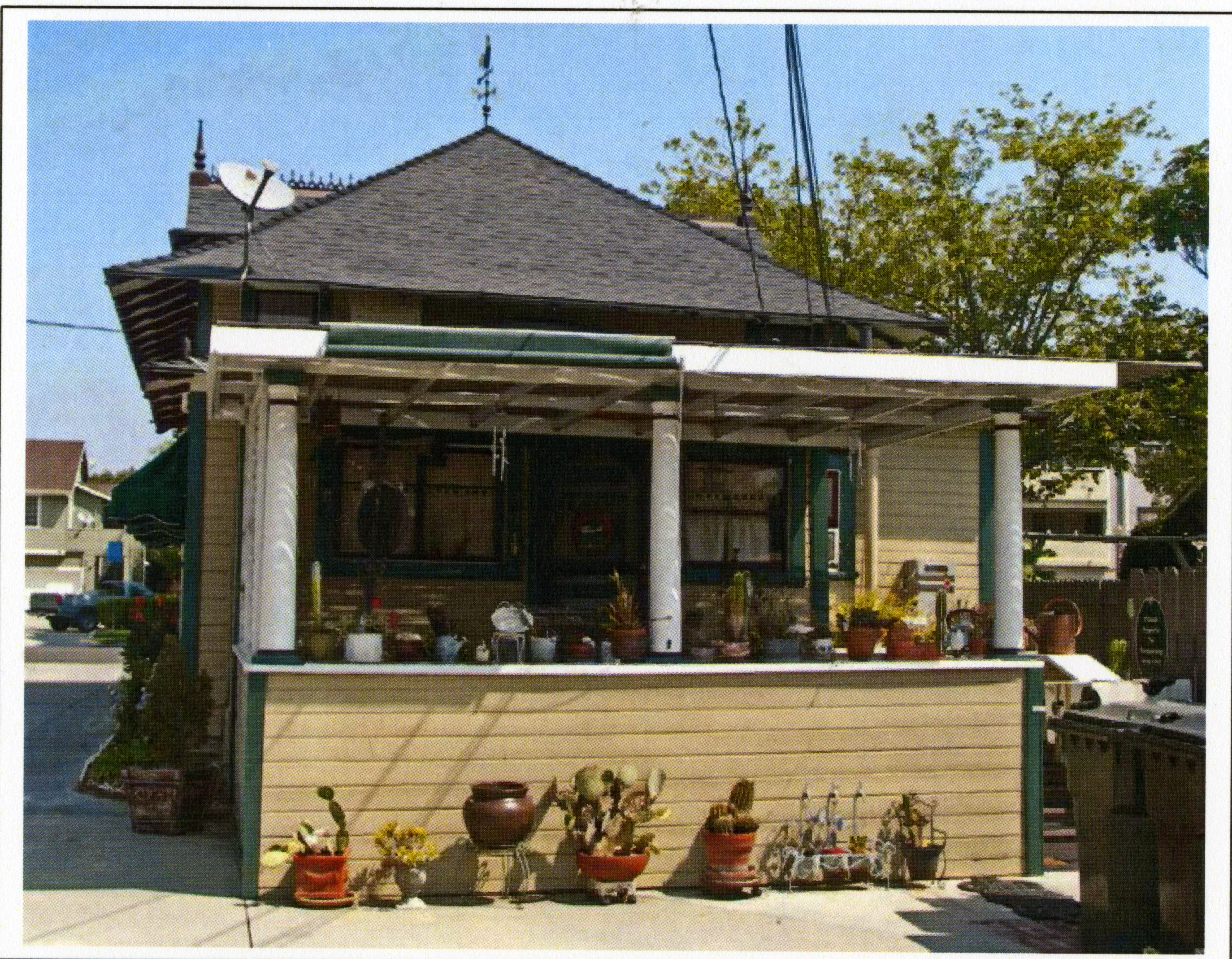 A colored photo of the rear exterior of the Herman Russell House in 2015.