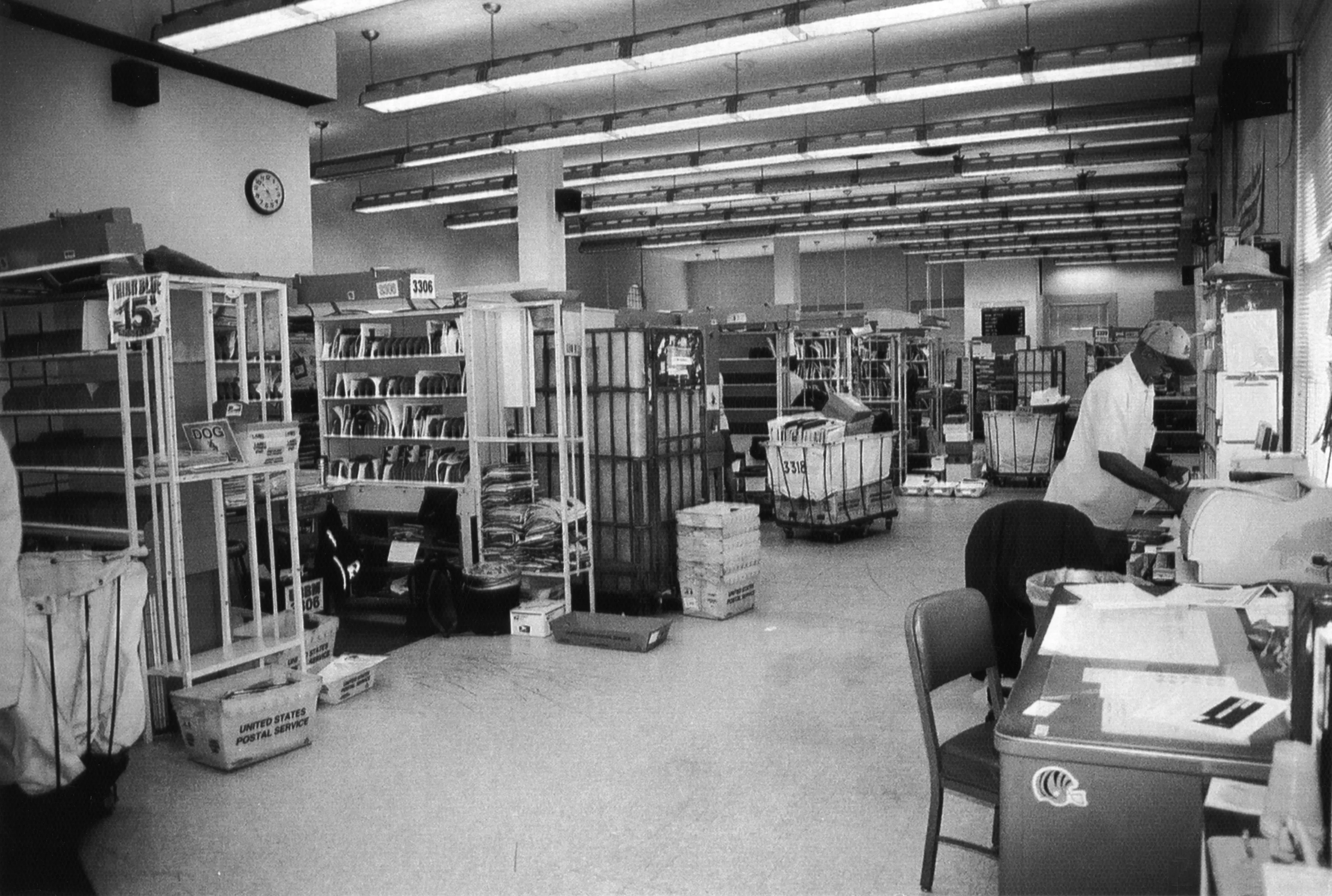 A black and white photograph of the workroom inside the Commonwealth Post Office in 2010.