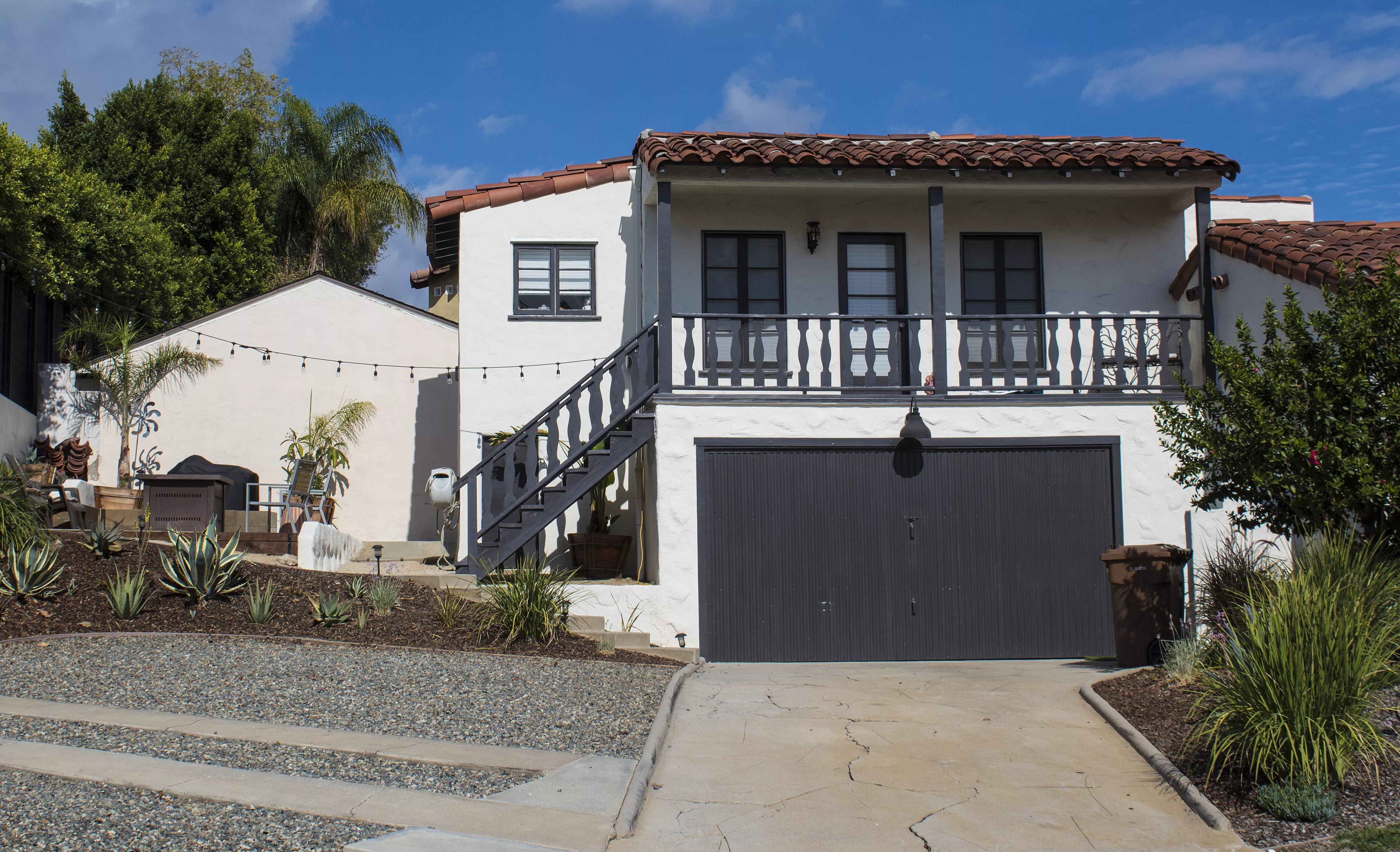 A colored photo of the attached garage with additional unit of the Otto Evans House in 2024.