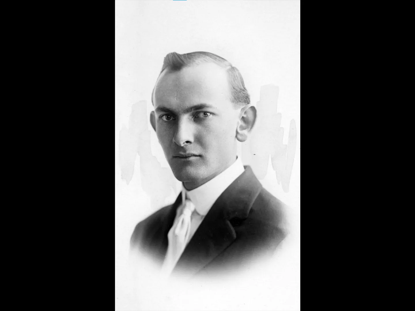 A black and white portrait photograph of Earl Dysinger.