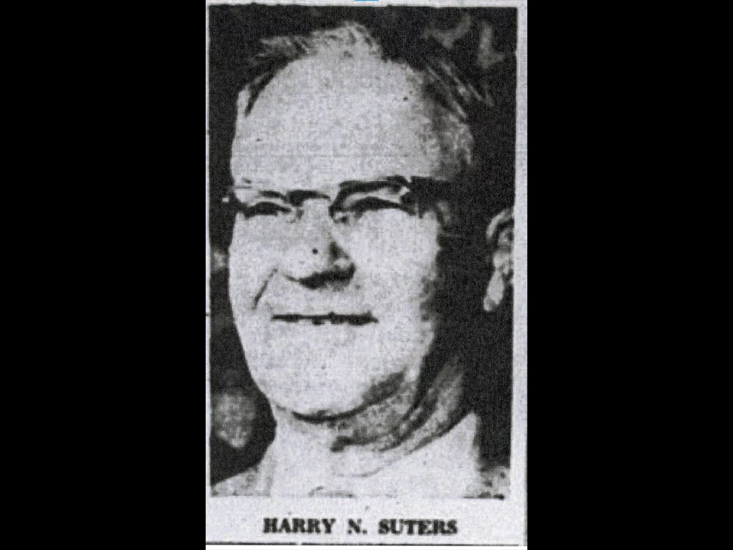 A black and white photograph of Harry Suters.