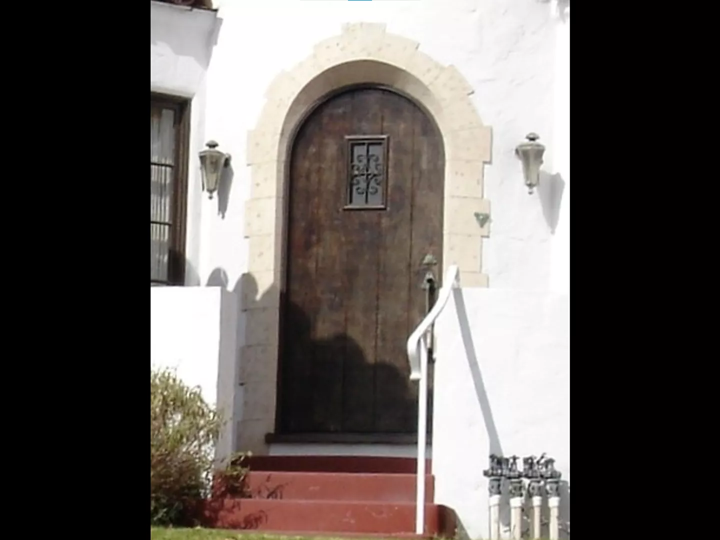 A colored photo of the hearse lights as fixtures for the Harry Suters House in 2024.