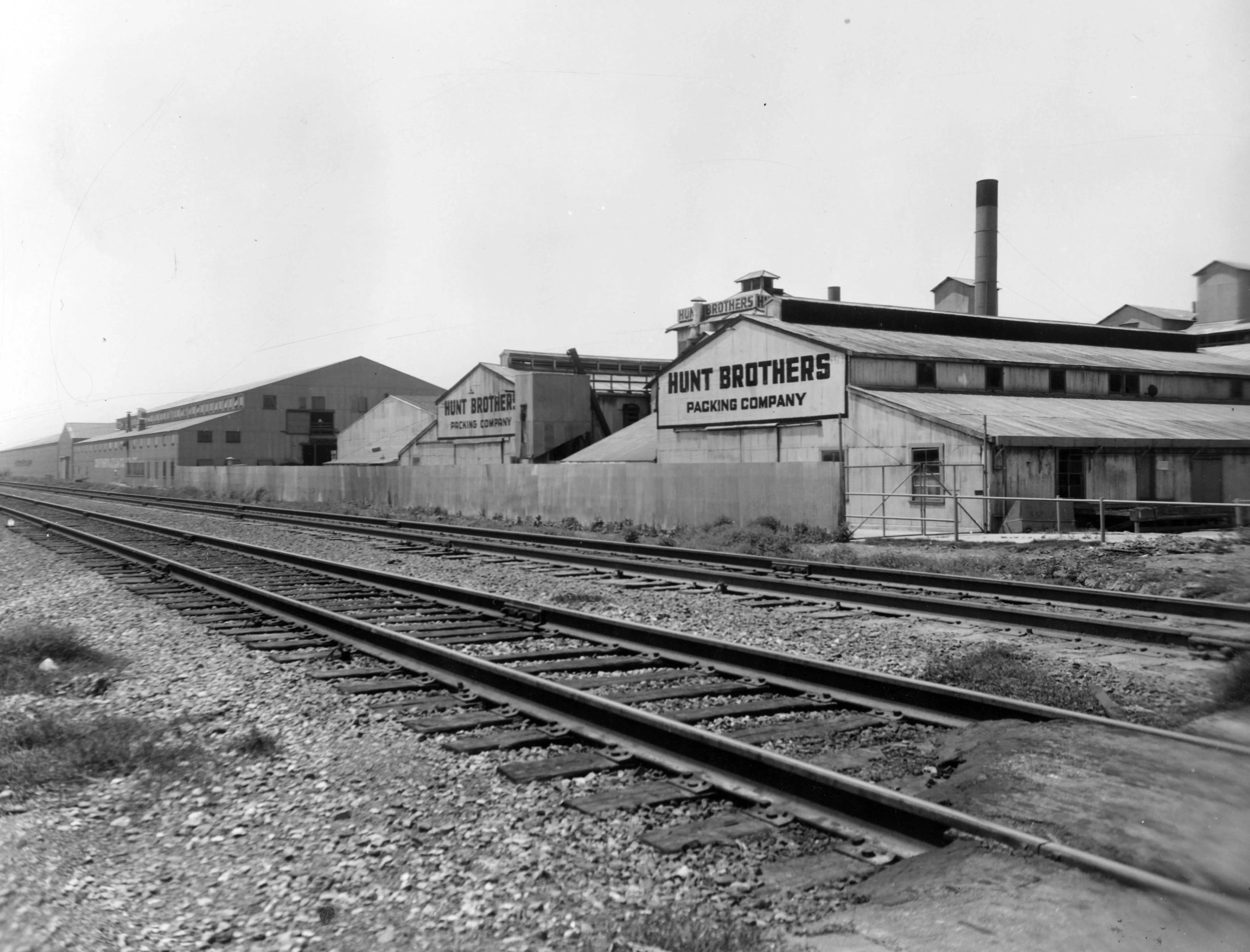 A black and white photograph of the Hunt Brothers Food Processing building.