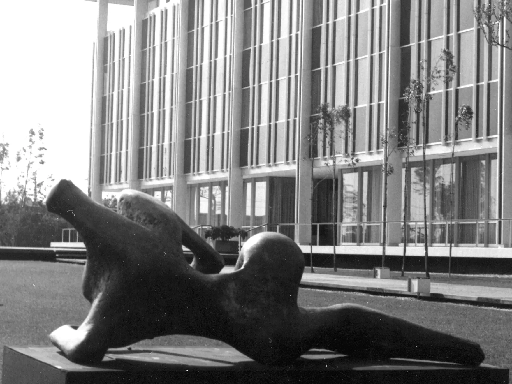 A black and white photograph of the Hunt Library with a sculpture located outside of the building.