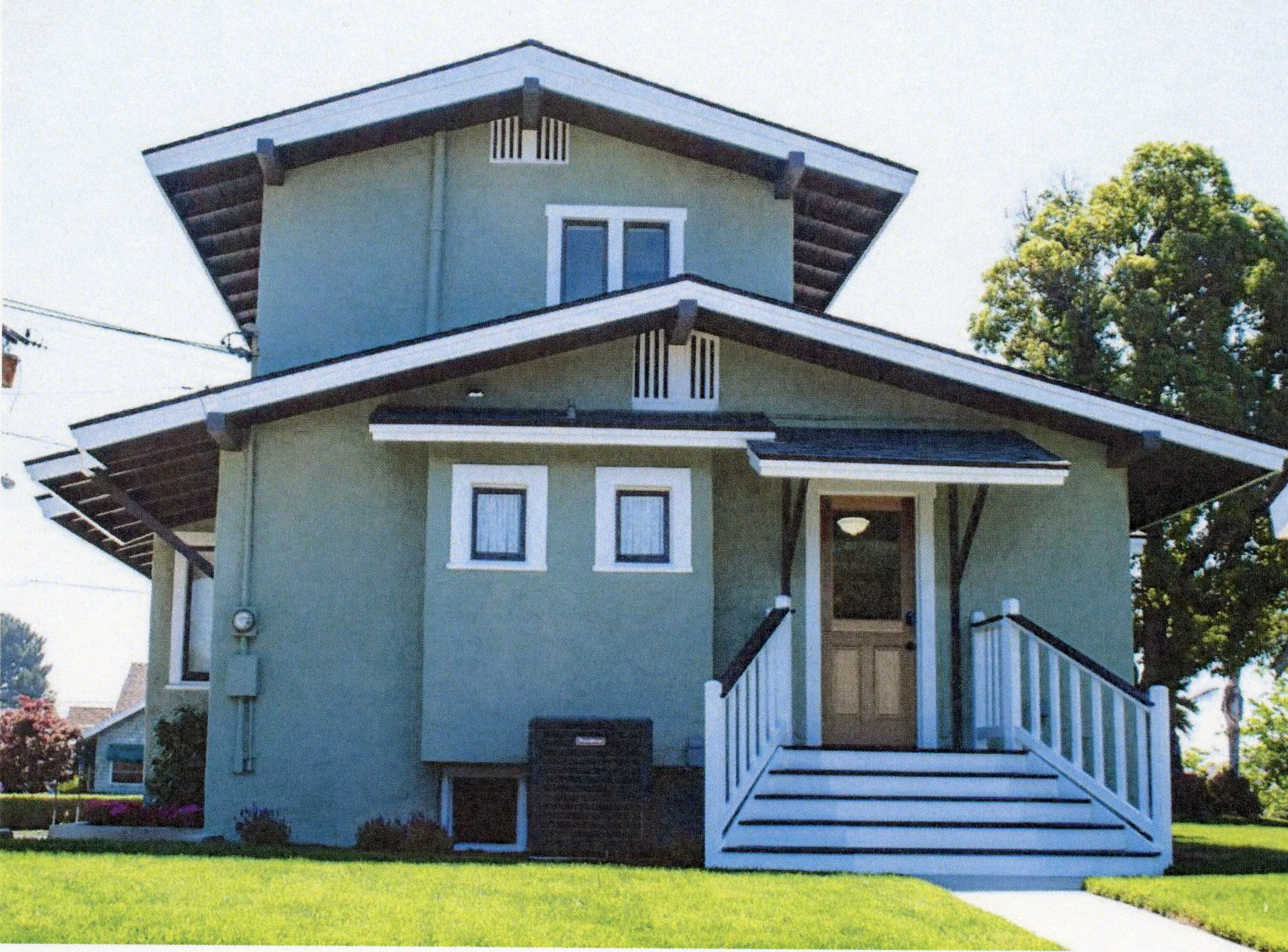 A colored photo of the rear exterior of the Louis Plummer House in 2024.