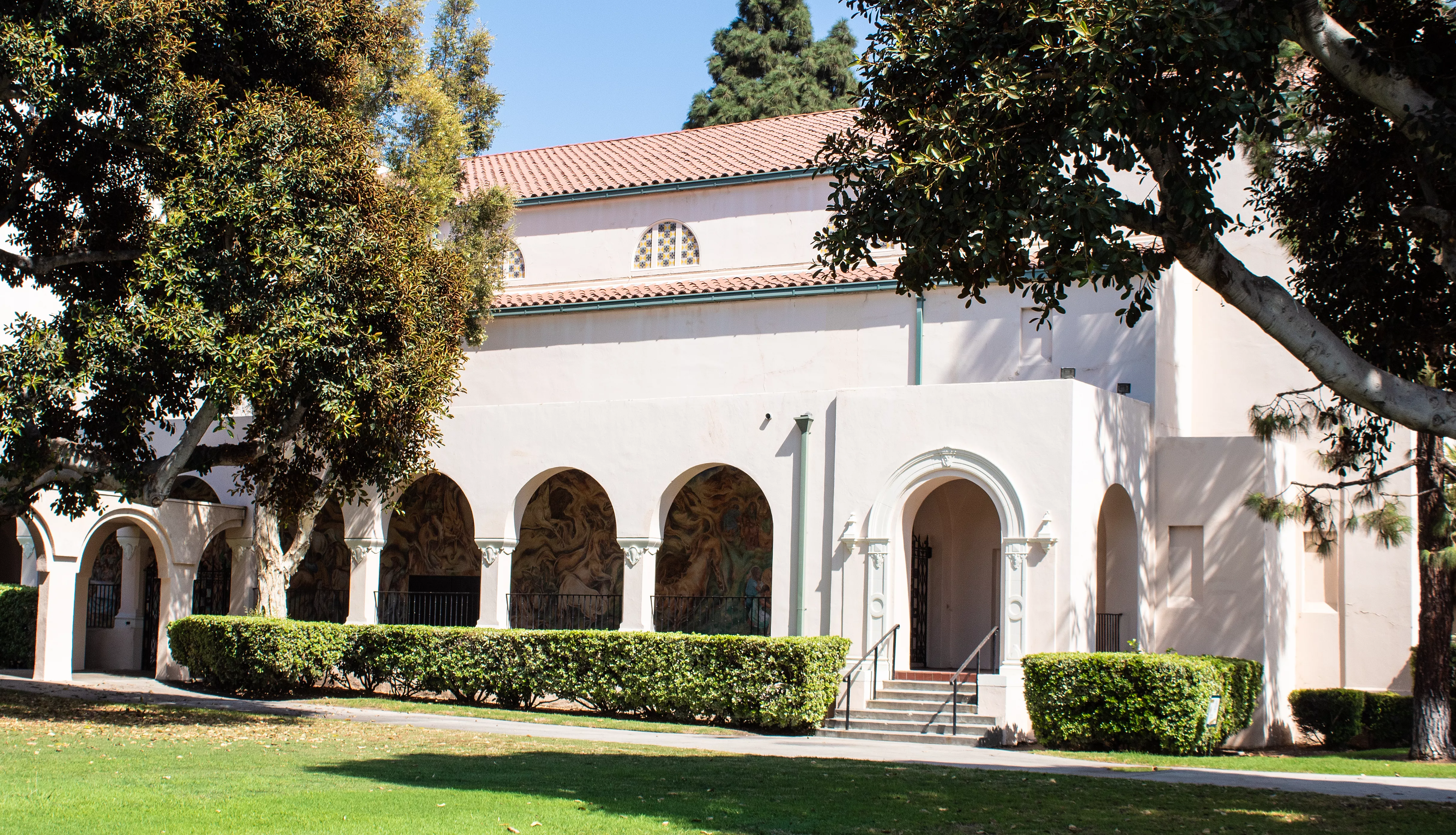 A colored photo of the west wall of the auditorium in 2021 where the &quot;Pastoral California&quot; Mural is located.