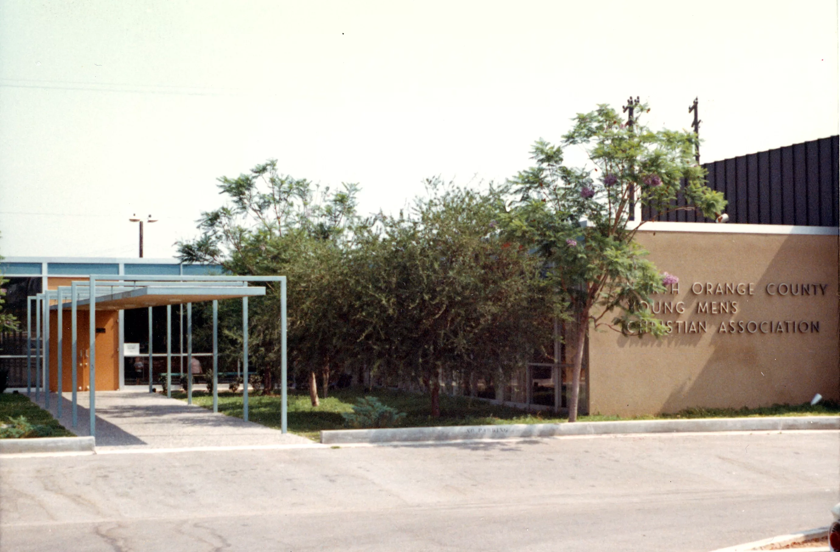 A colored photo of the exterior of the YMCA in 1966.