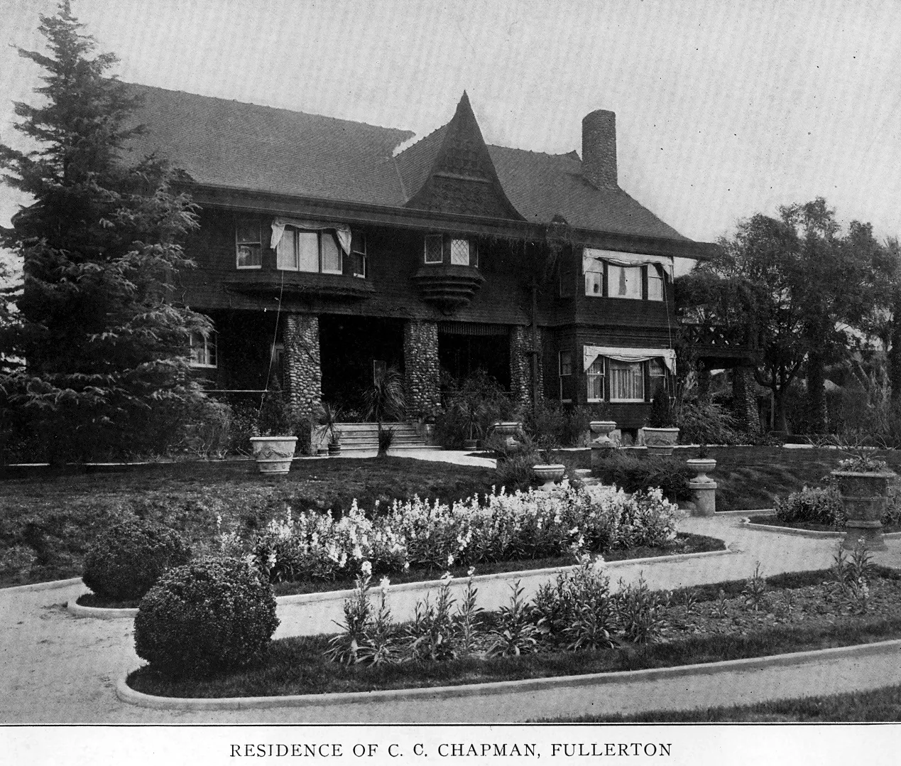 A black and white photograph of the Chapman House taken in 1922. A typed caption below the photo reads: RESIDENCE OF C. C. CHAPMAN, FULLERTON.