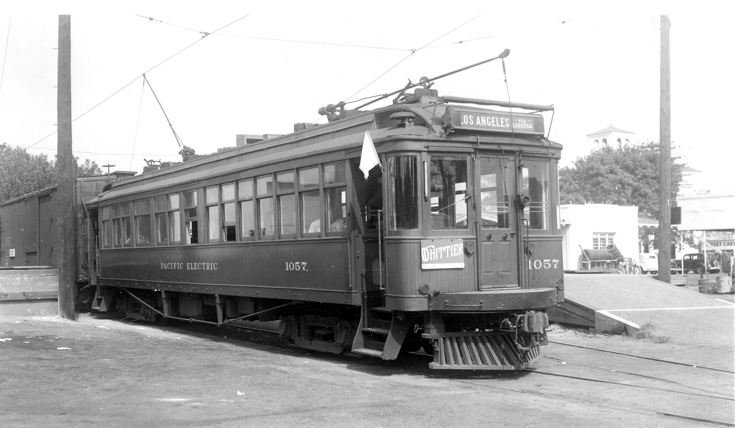 A black and white photograph of the Pacific Electric car at the rear of the depot.